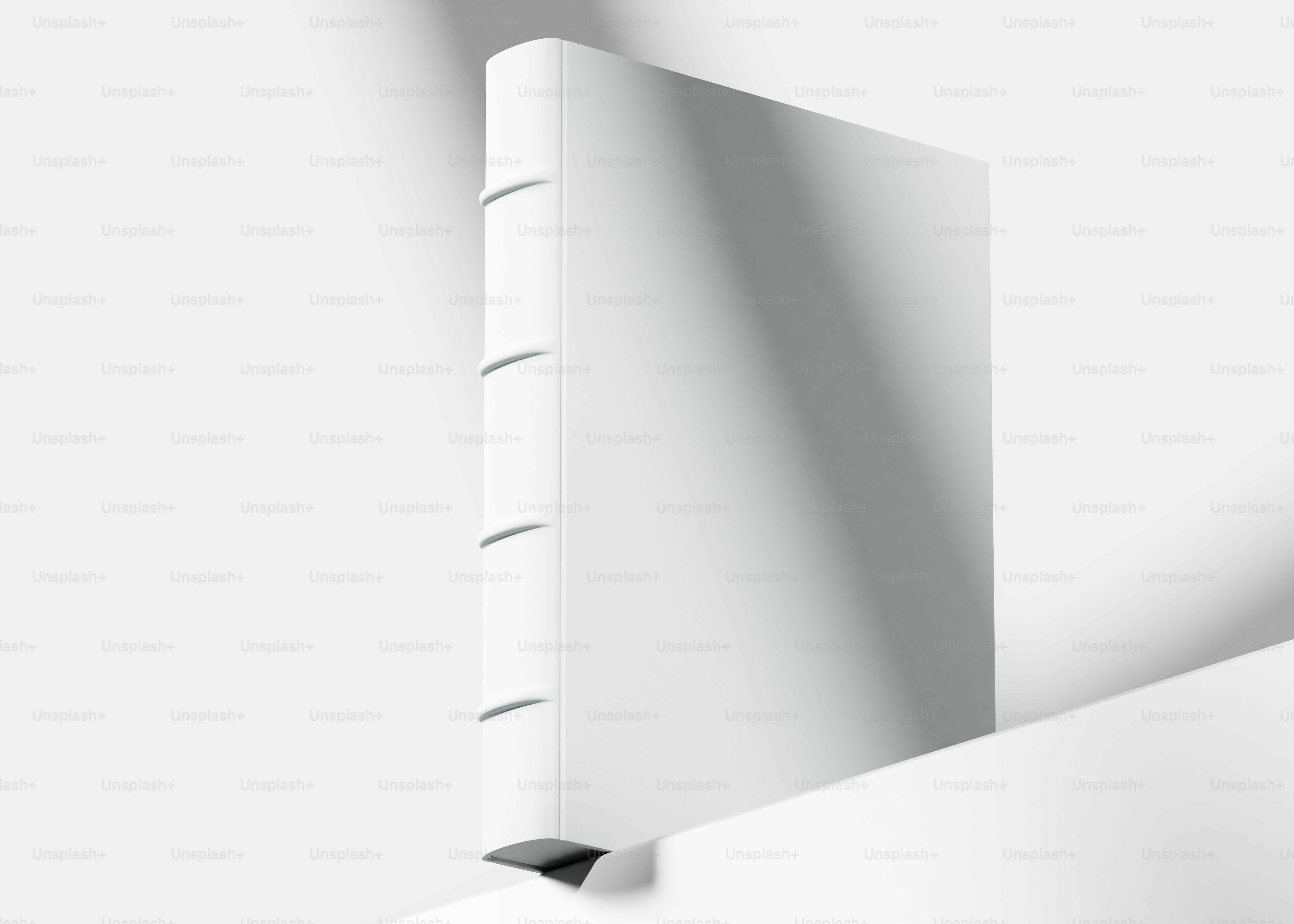 The corner of a white wall with a shadow on it