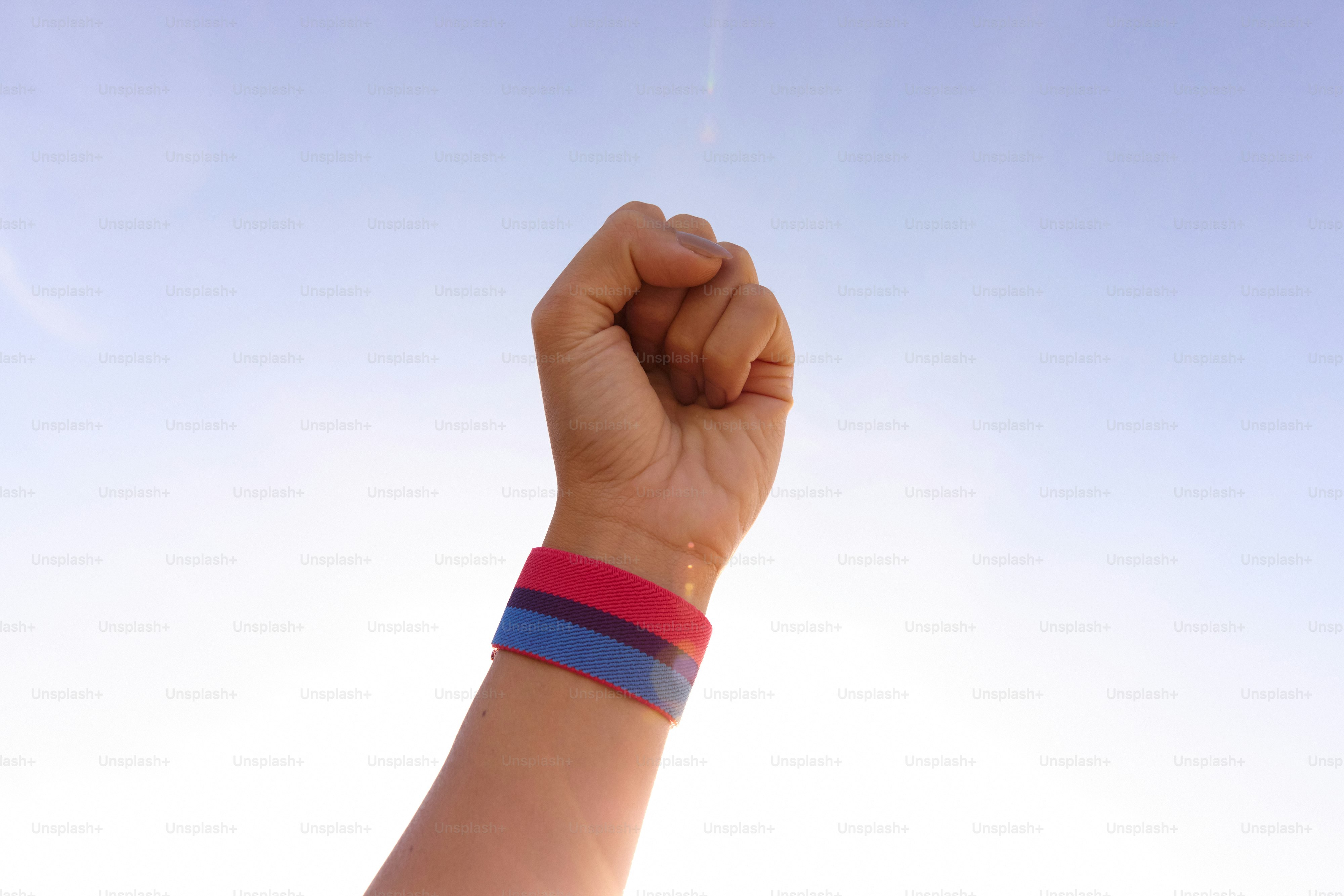 A person holding a kite in the air