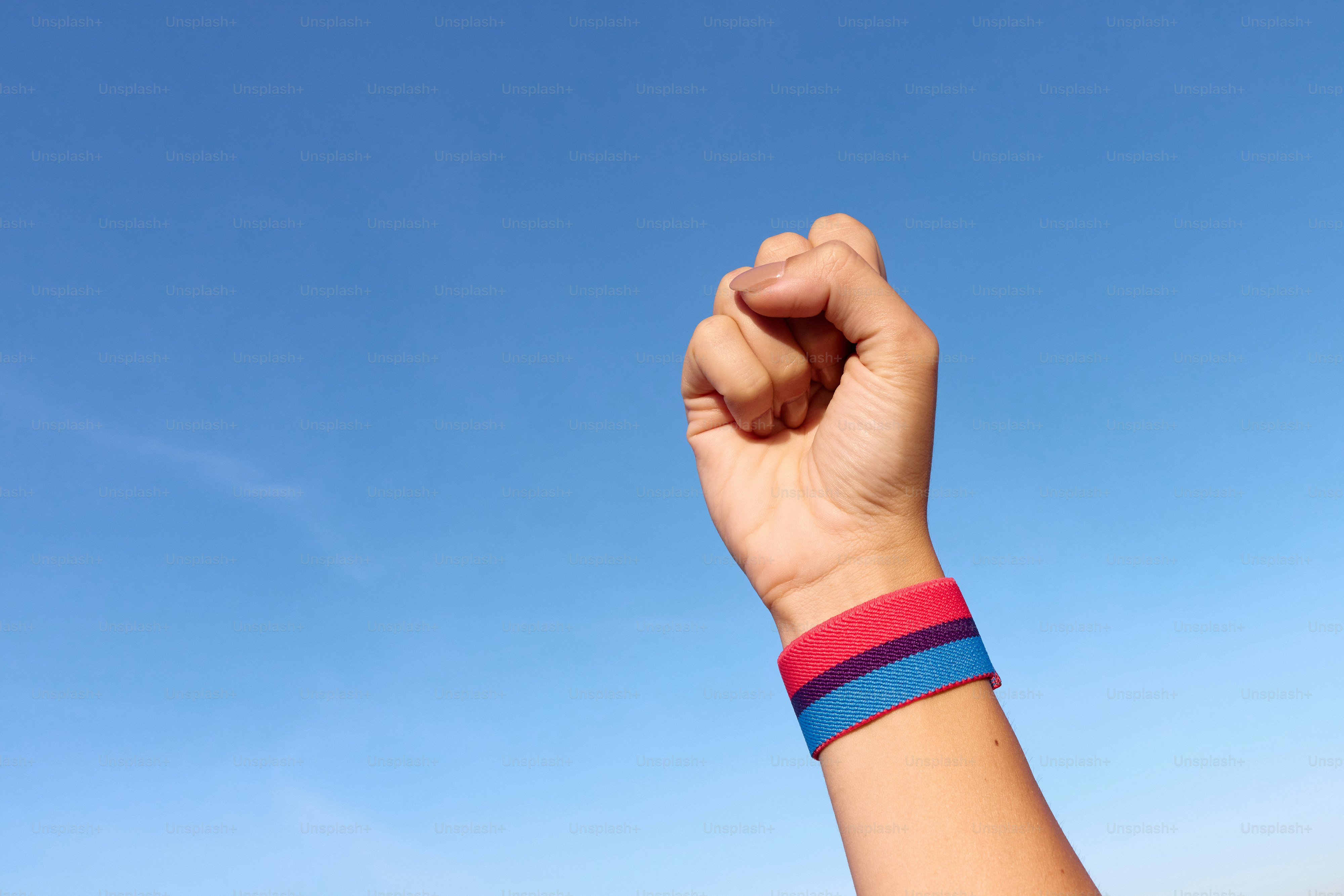A person holding a kite in the air