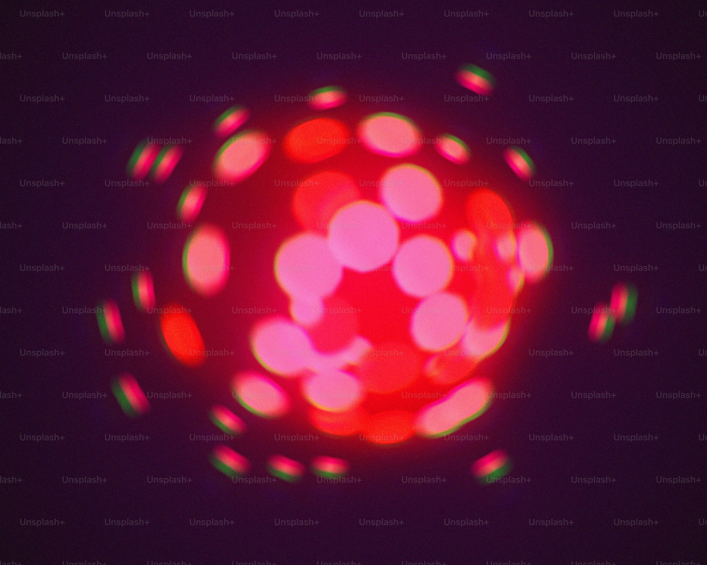 a close up of a red object with a black background