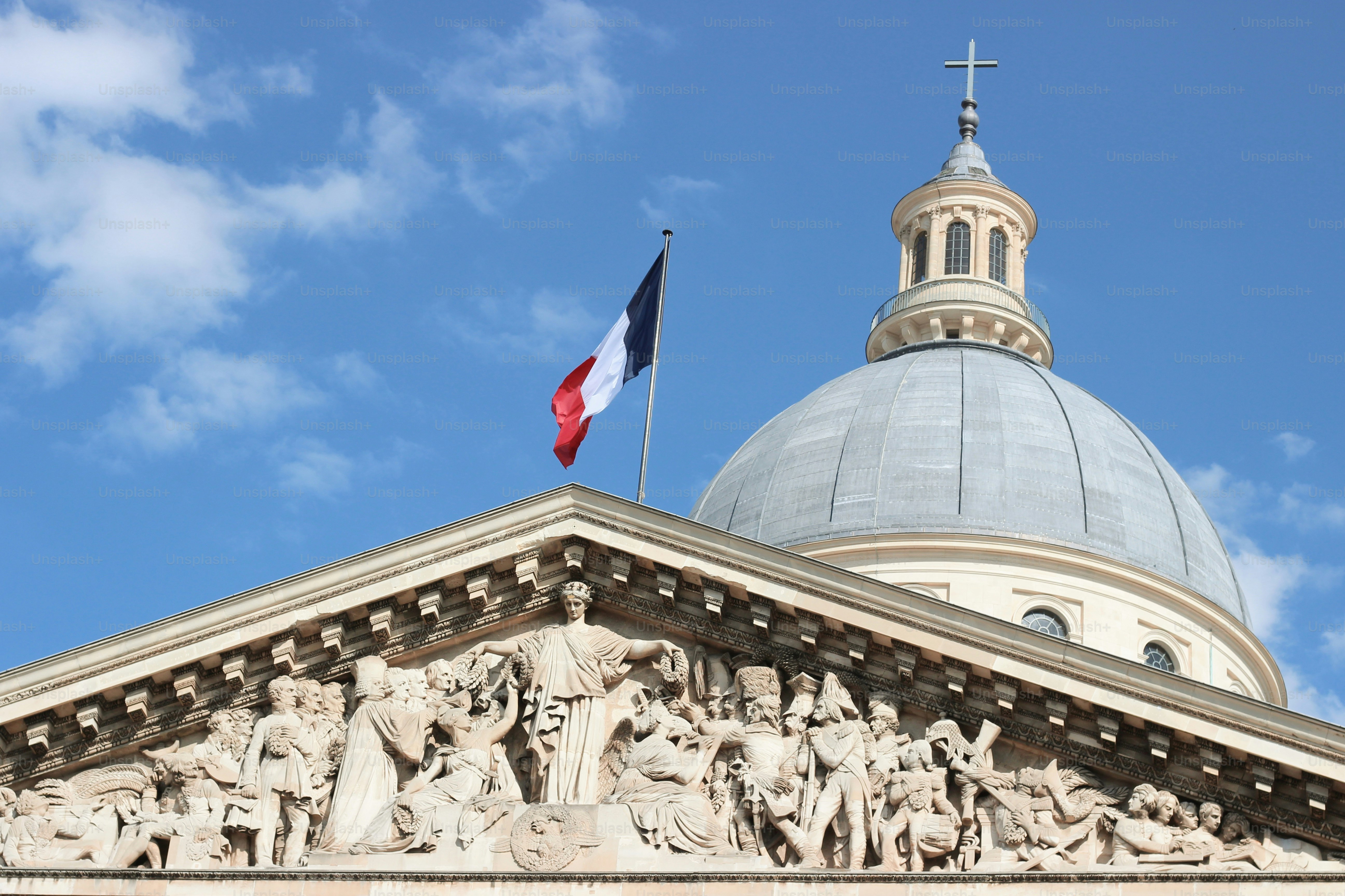 A building with a dome and a flag on top