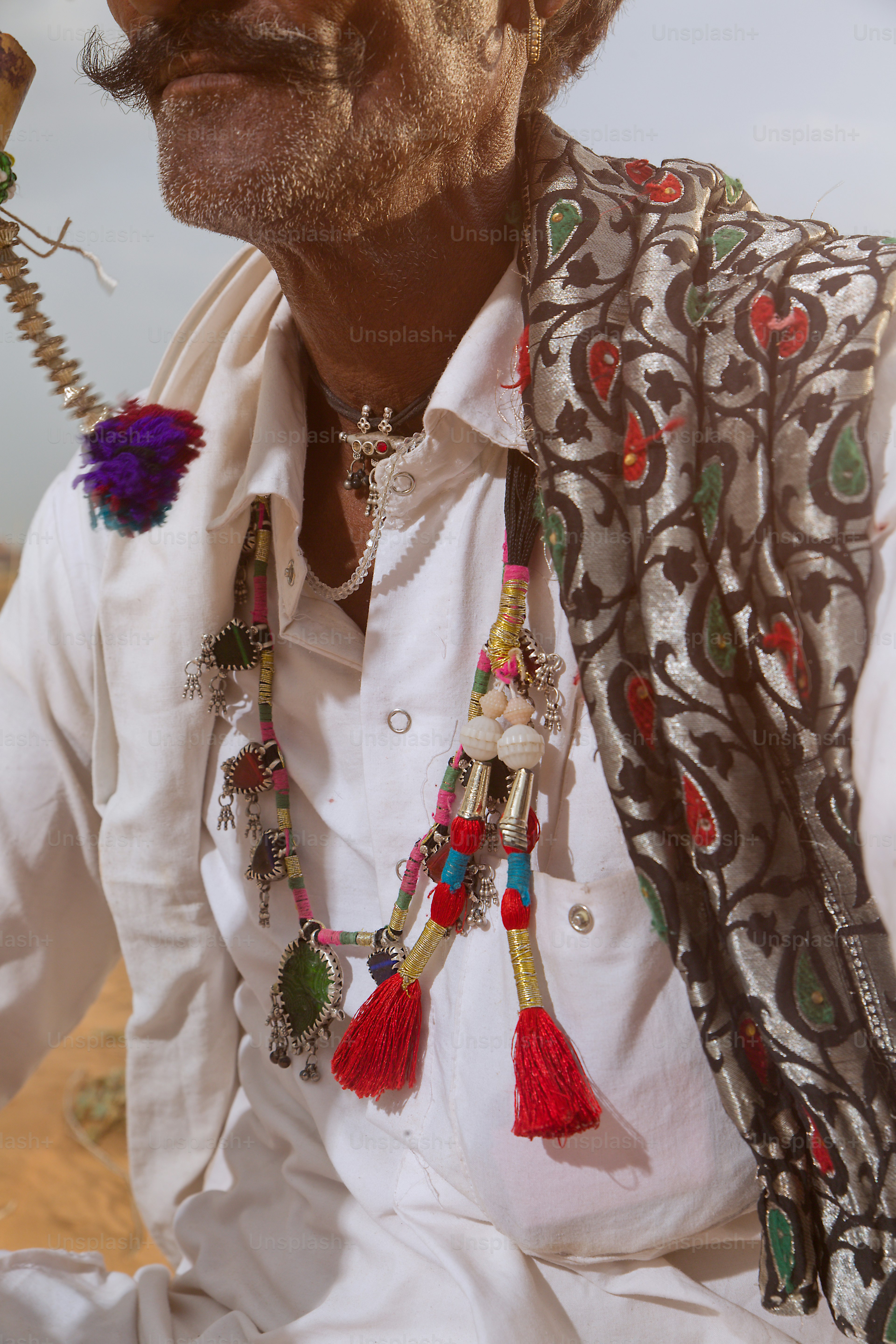 A man in a white shirt and a red hat