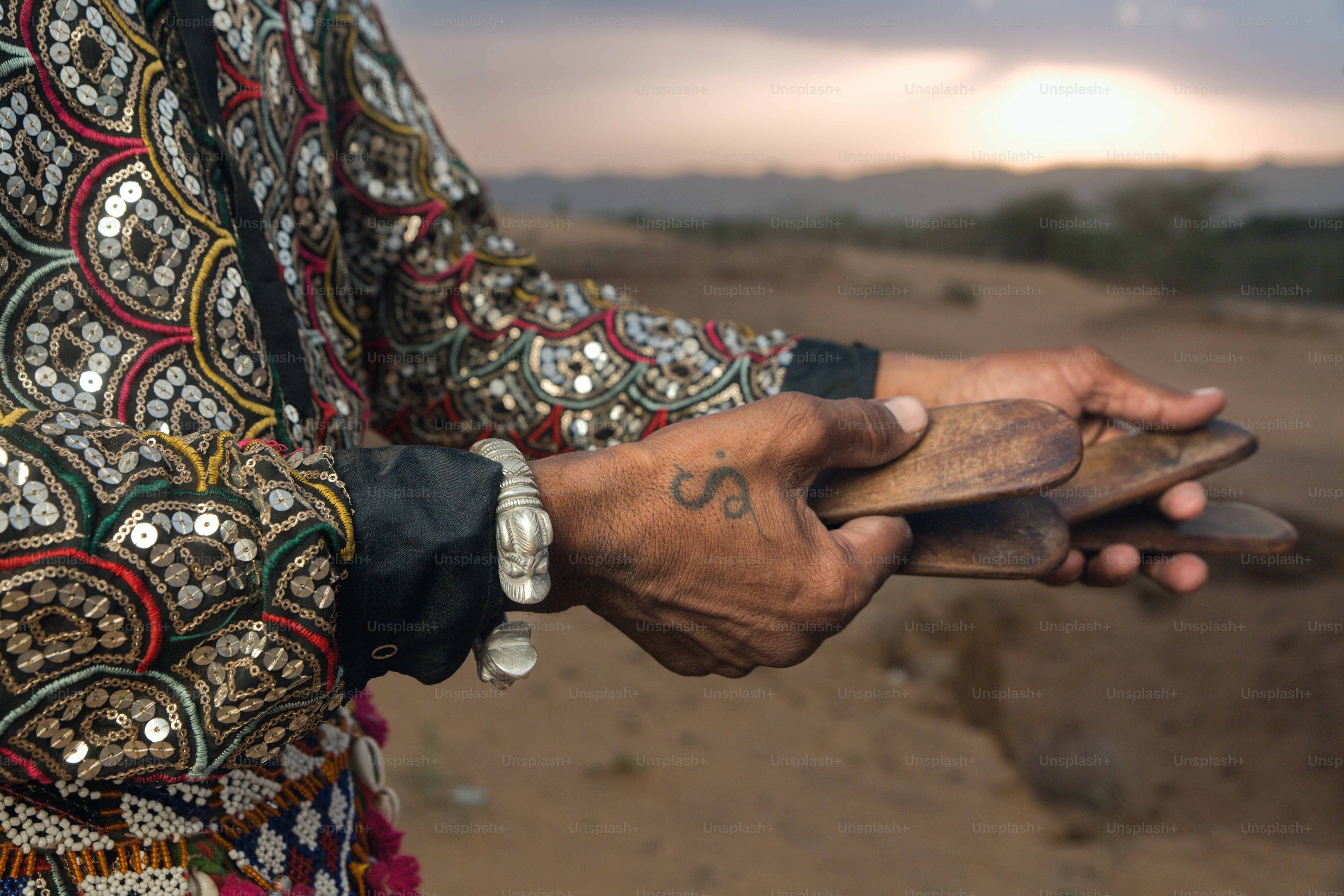 A person holding a piece of wood in their hands