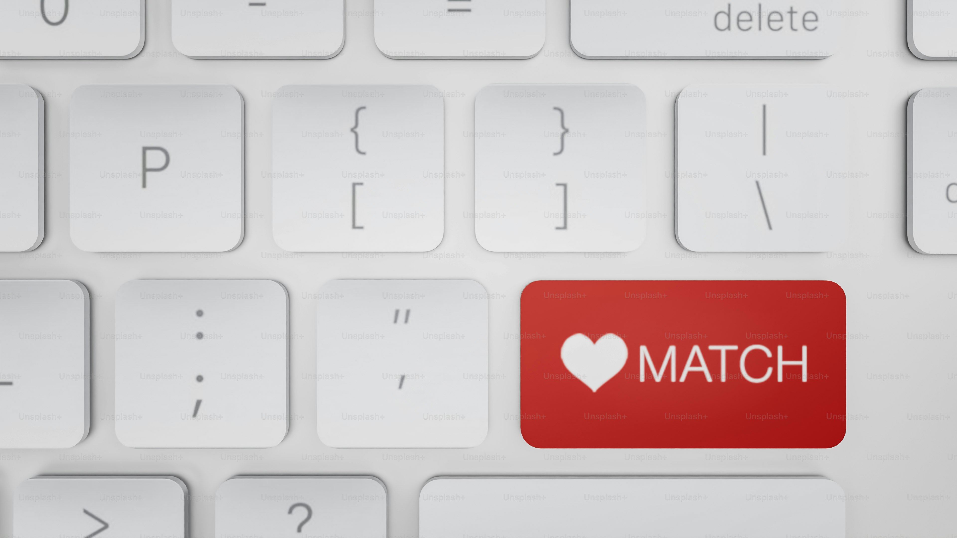 A red match button on a white keyboard