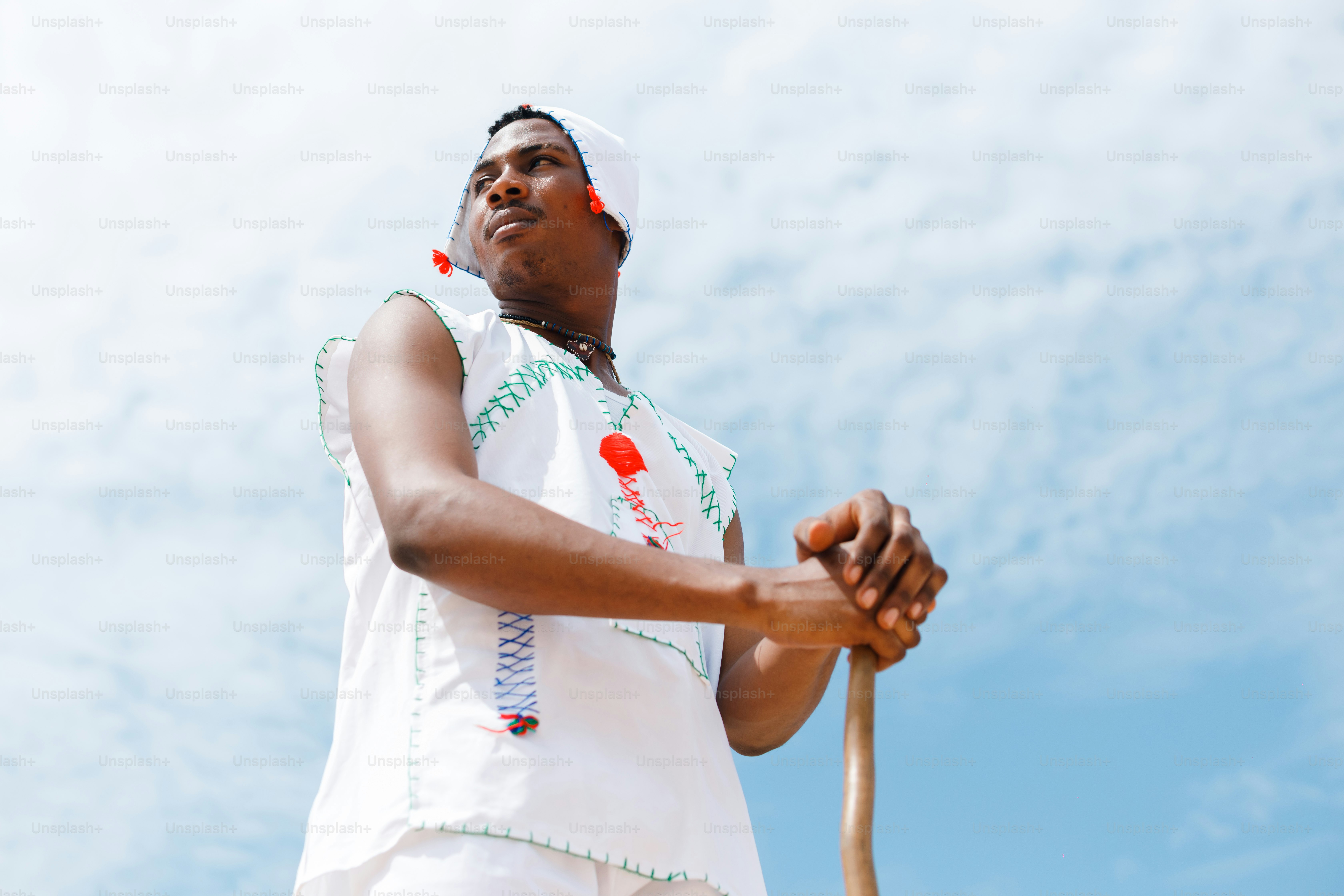 A man holding a baseball bat on top of a field