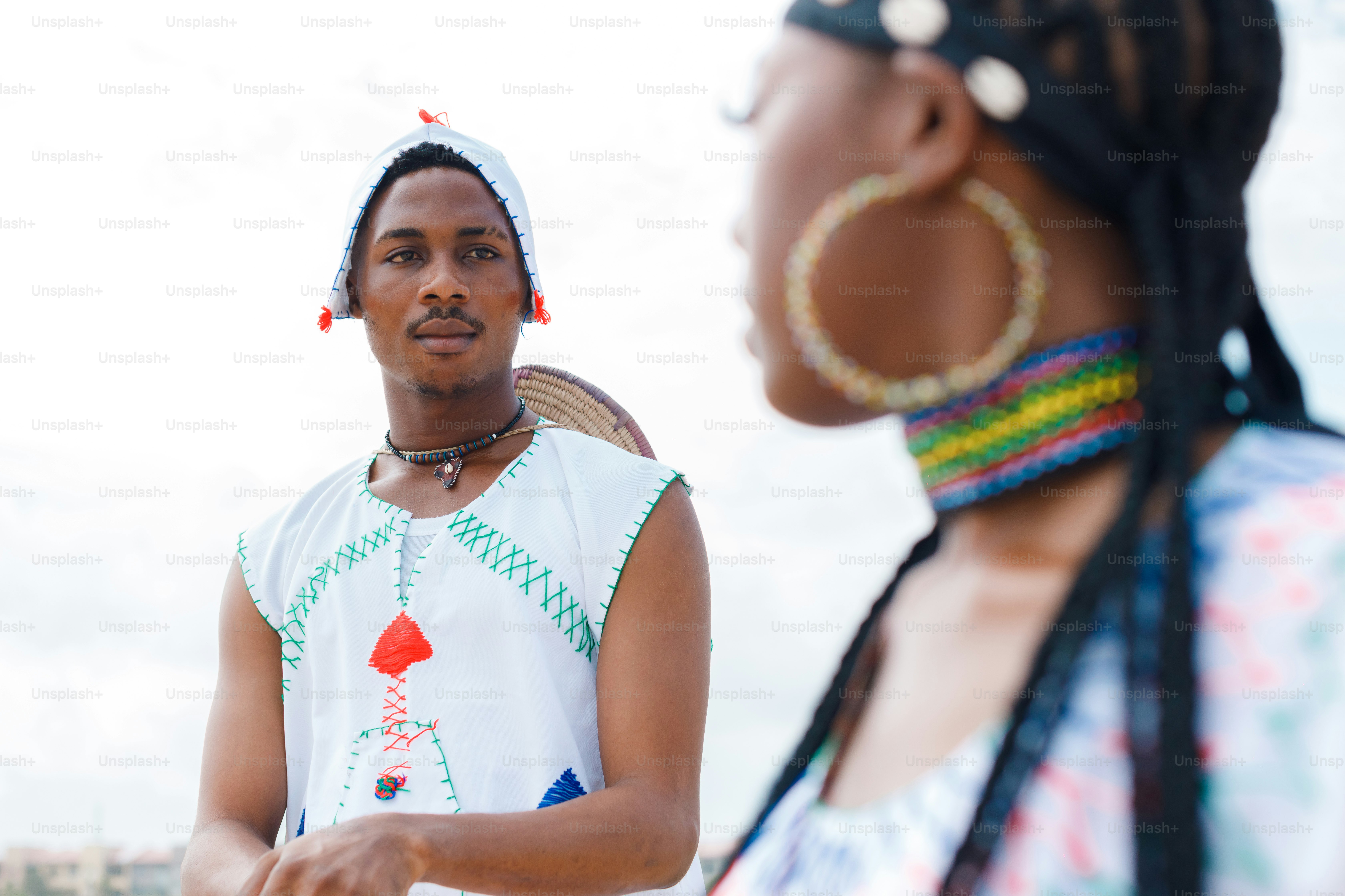 A woman standing next to a man in a white shirt