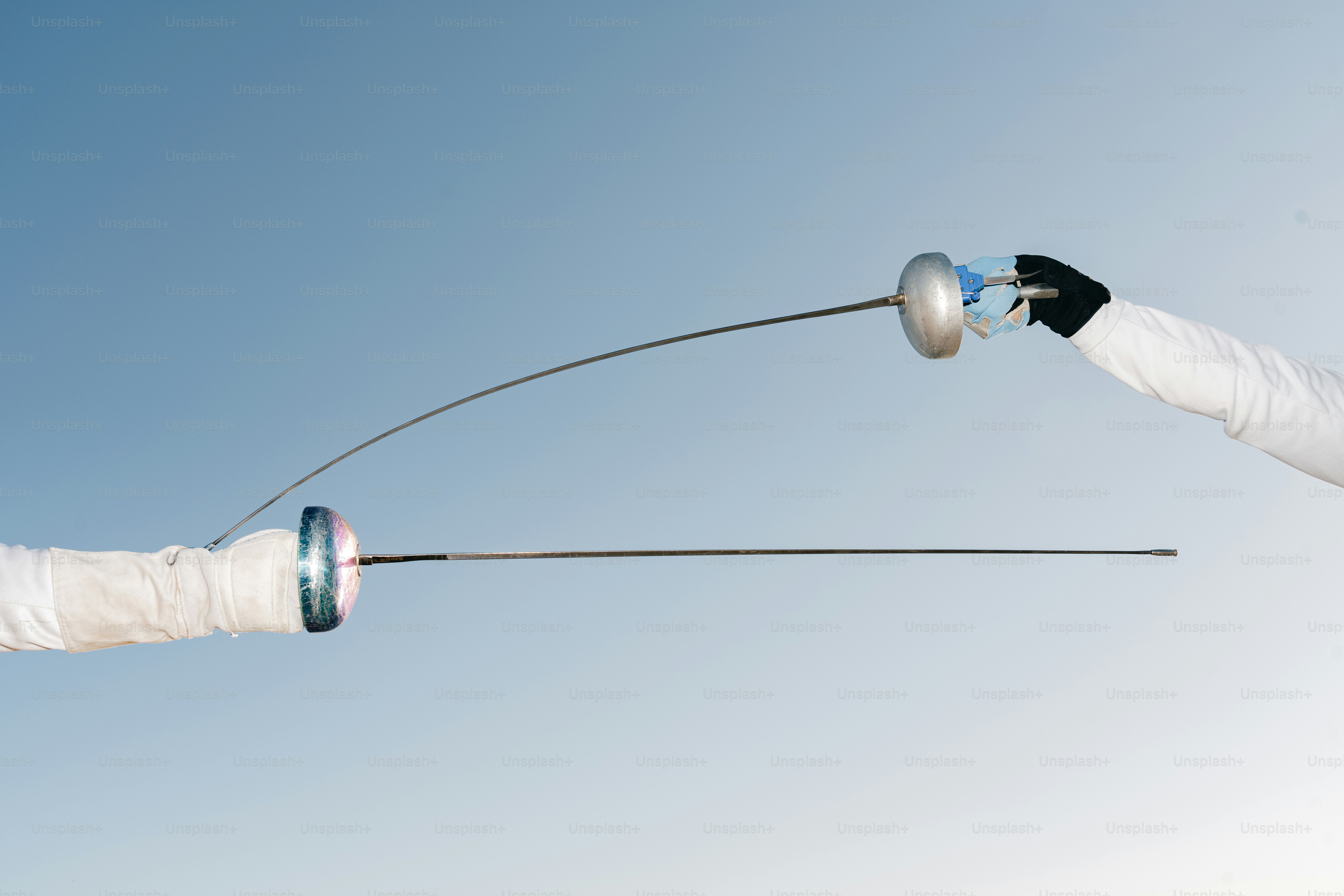 A man flying through the air while riding a kite