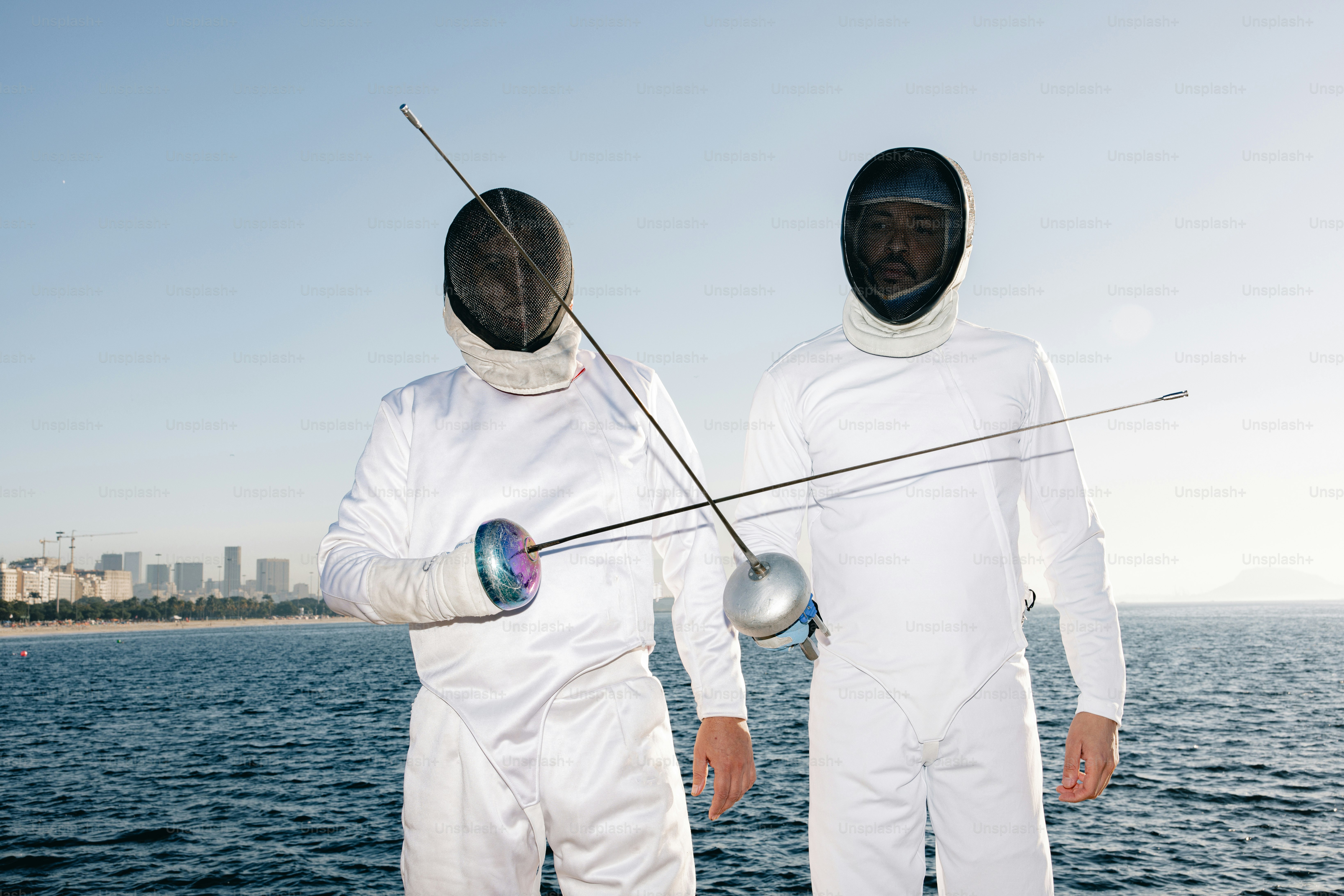 Two men in white suits standing on a boat