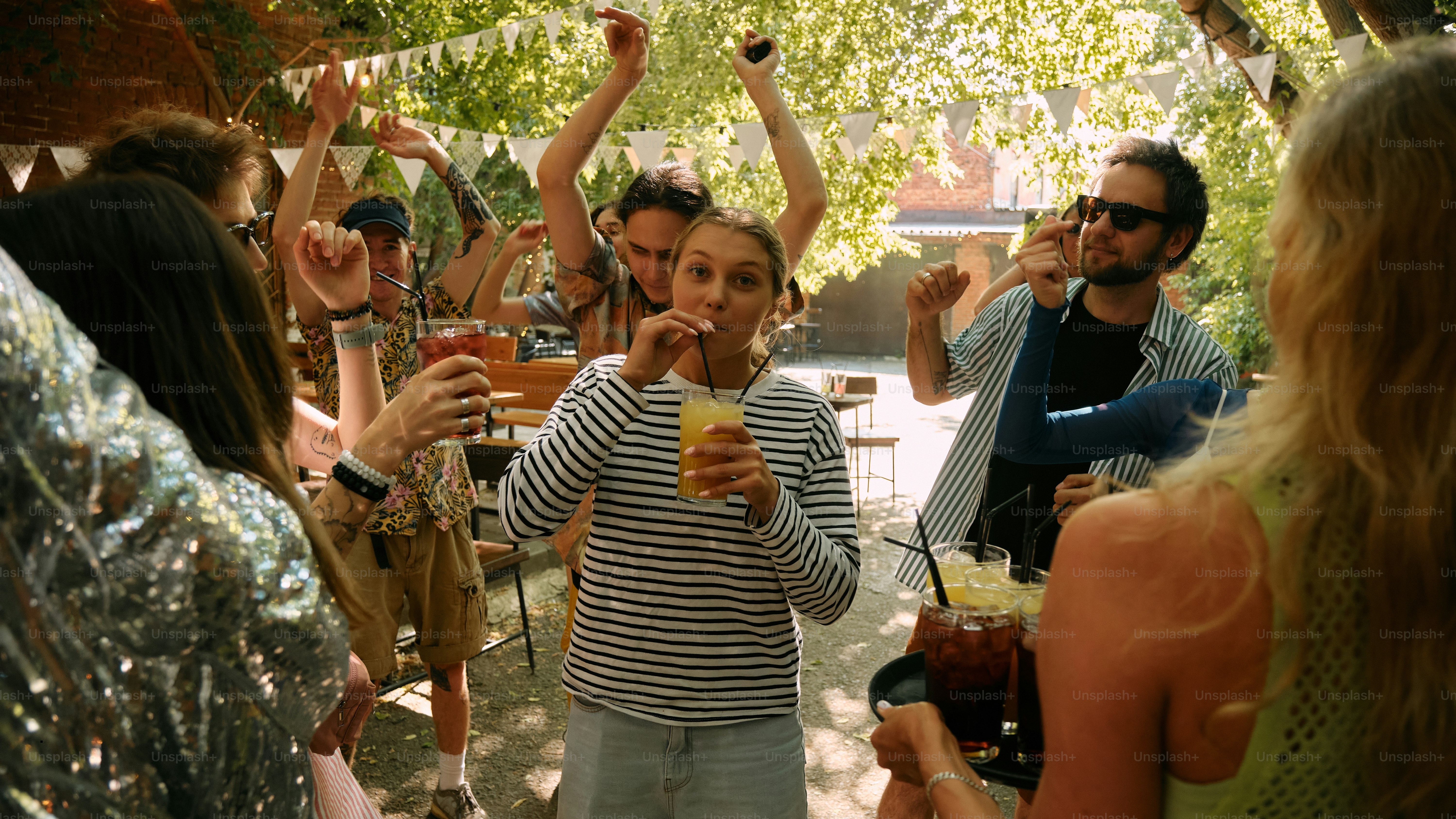 A group of people standing around each other