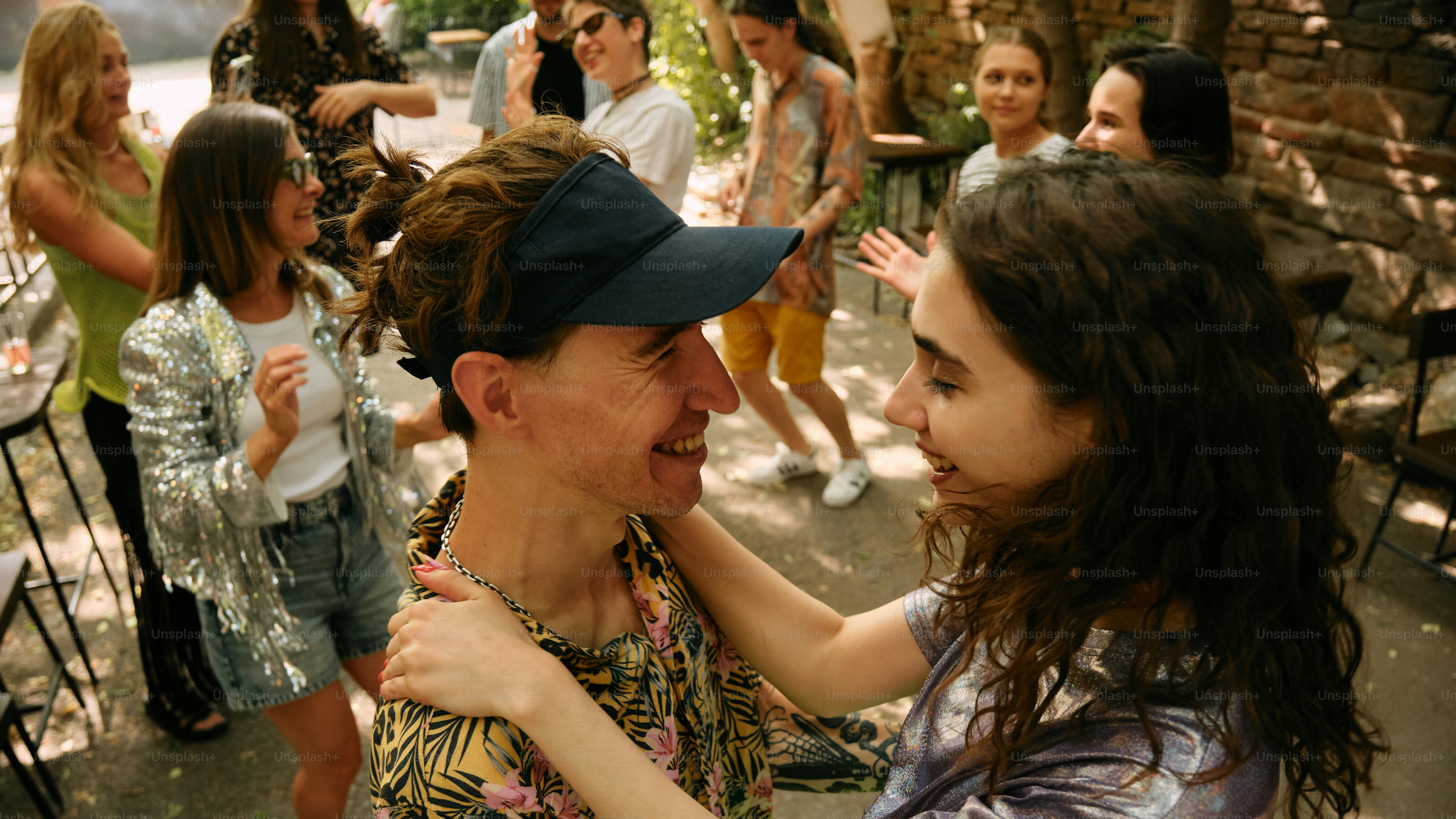 A group of people standing around each other
