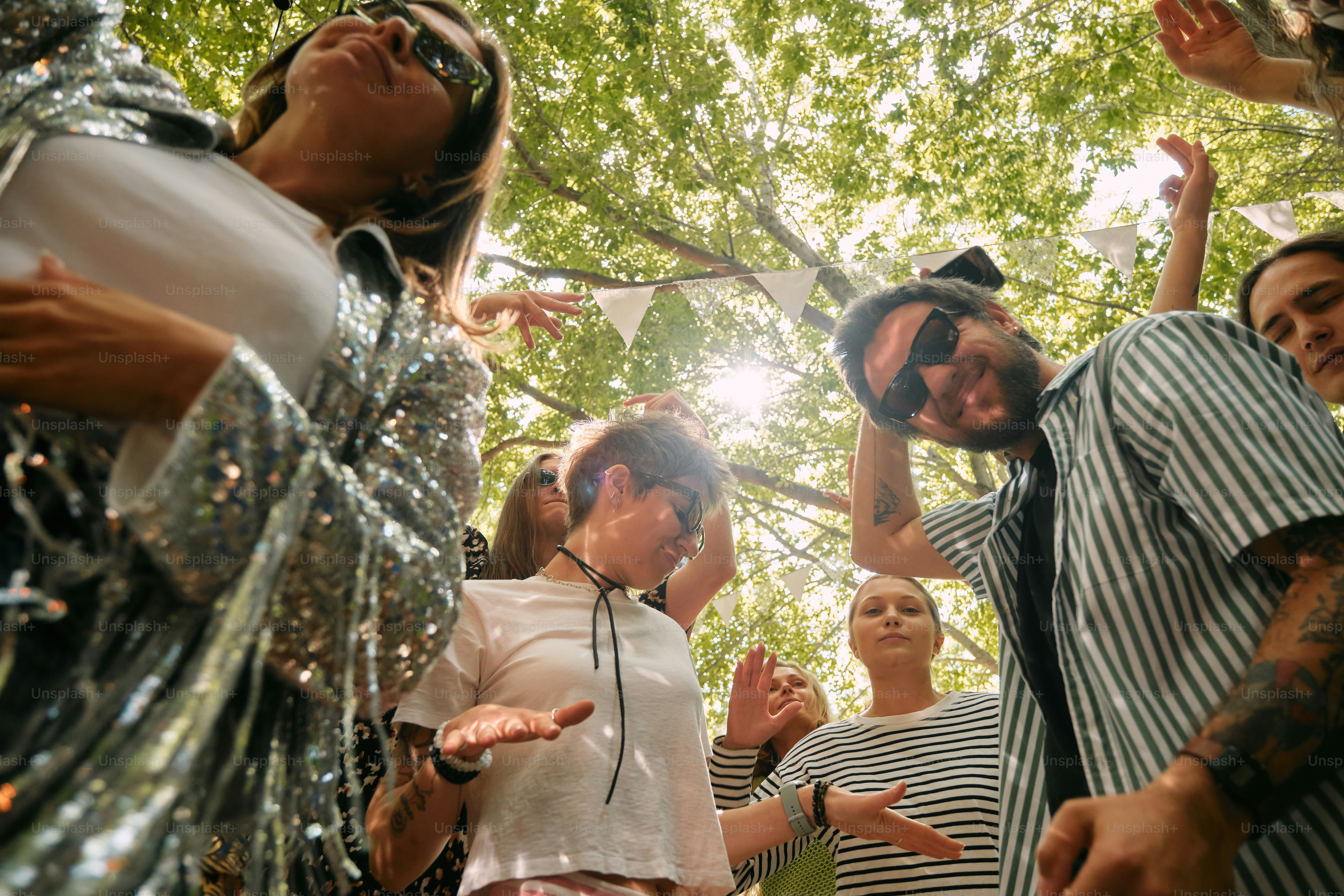 A group of people standing around each other