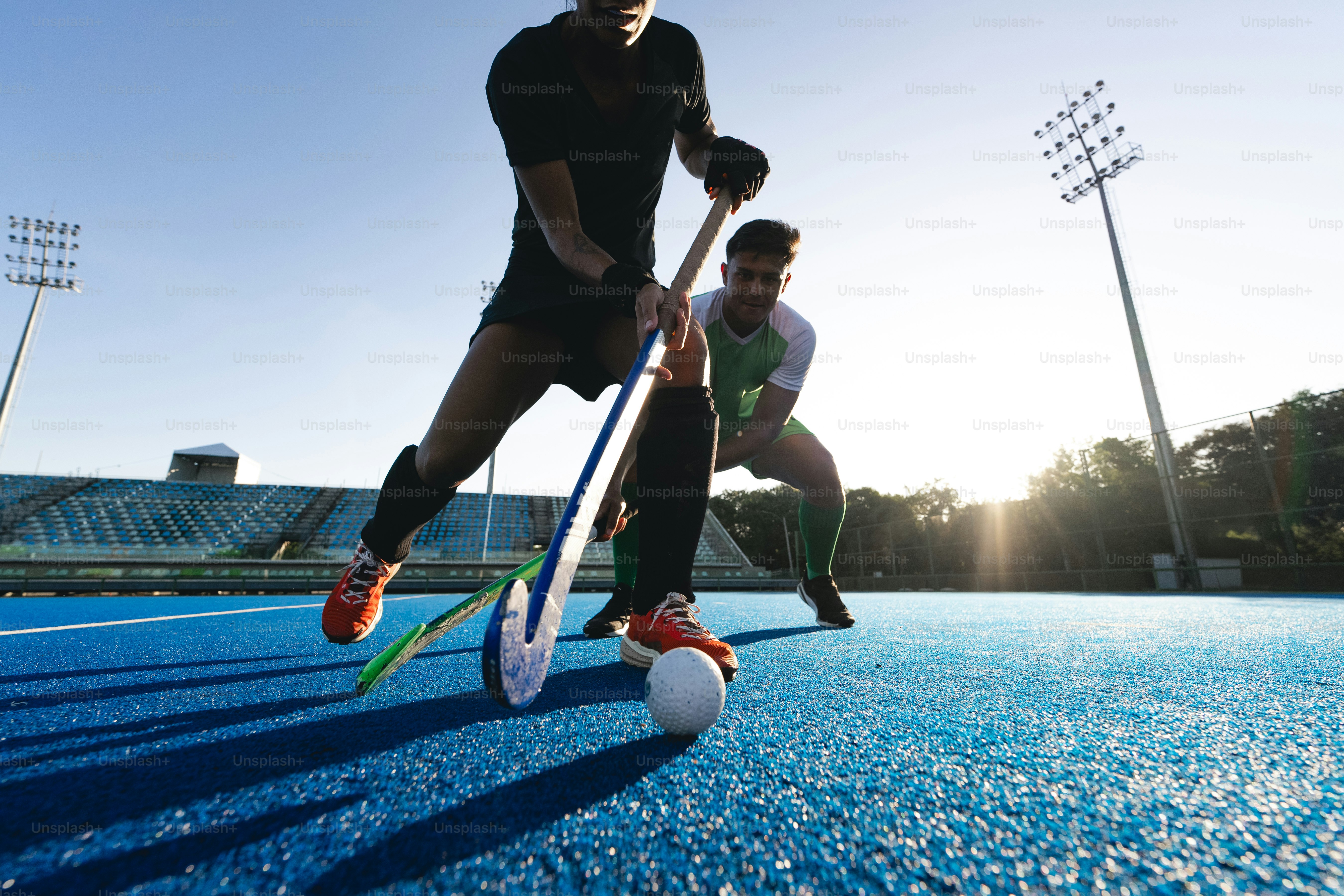 A couple of men standing on top of a tennis court