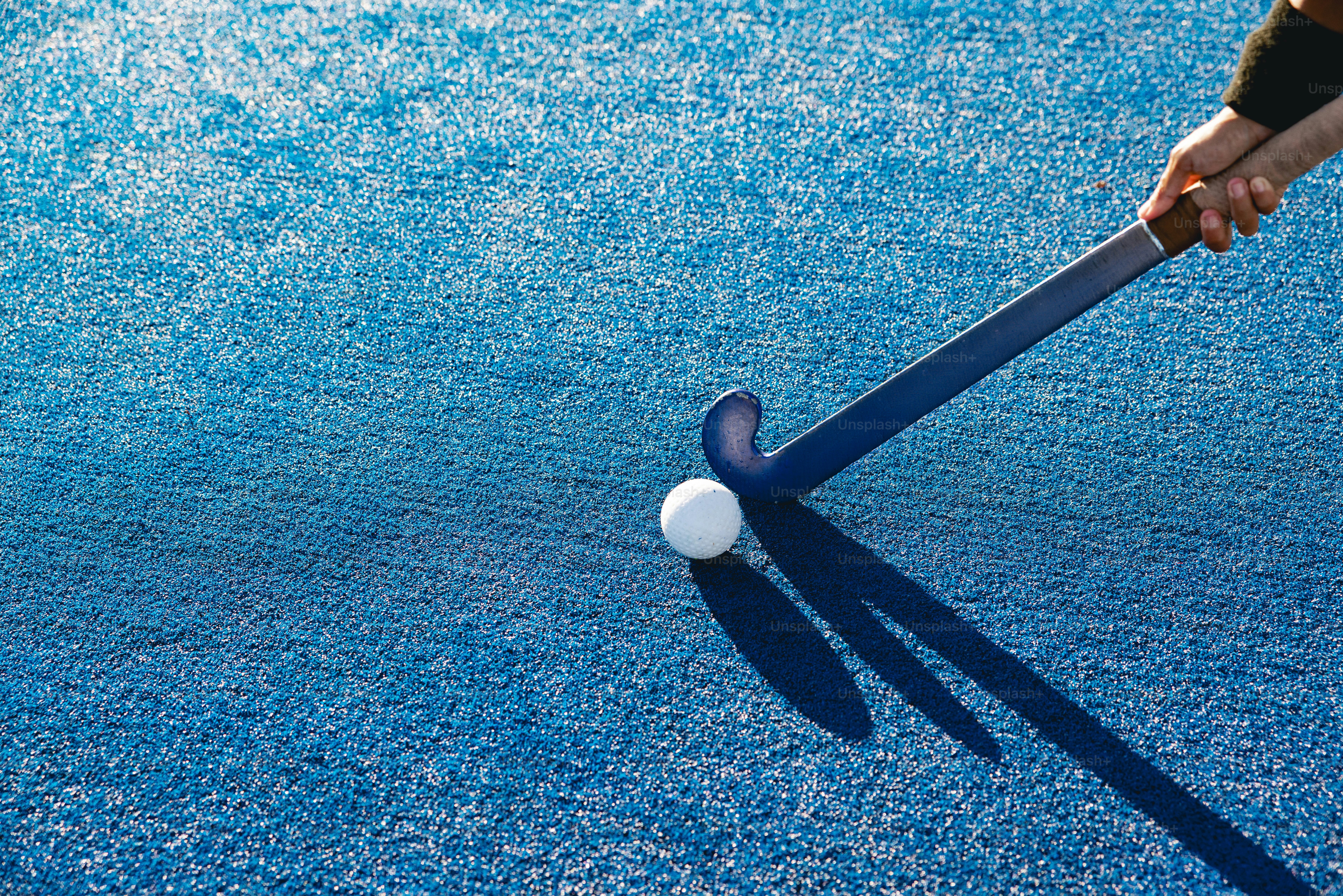 A person hitting a ball with a bat