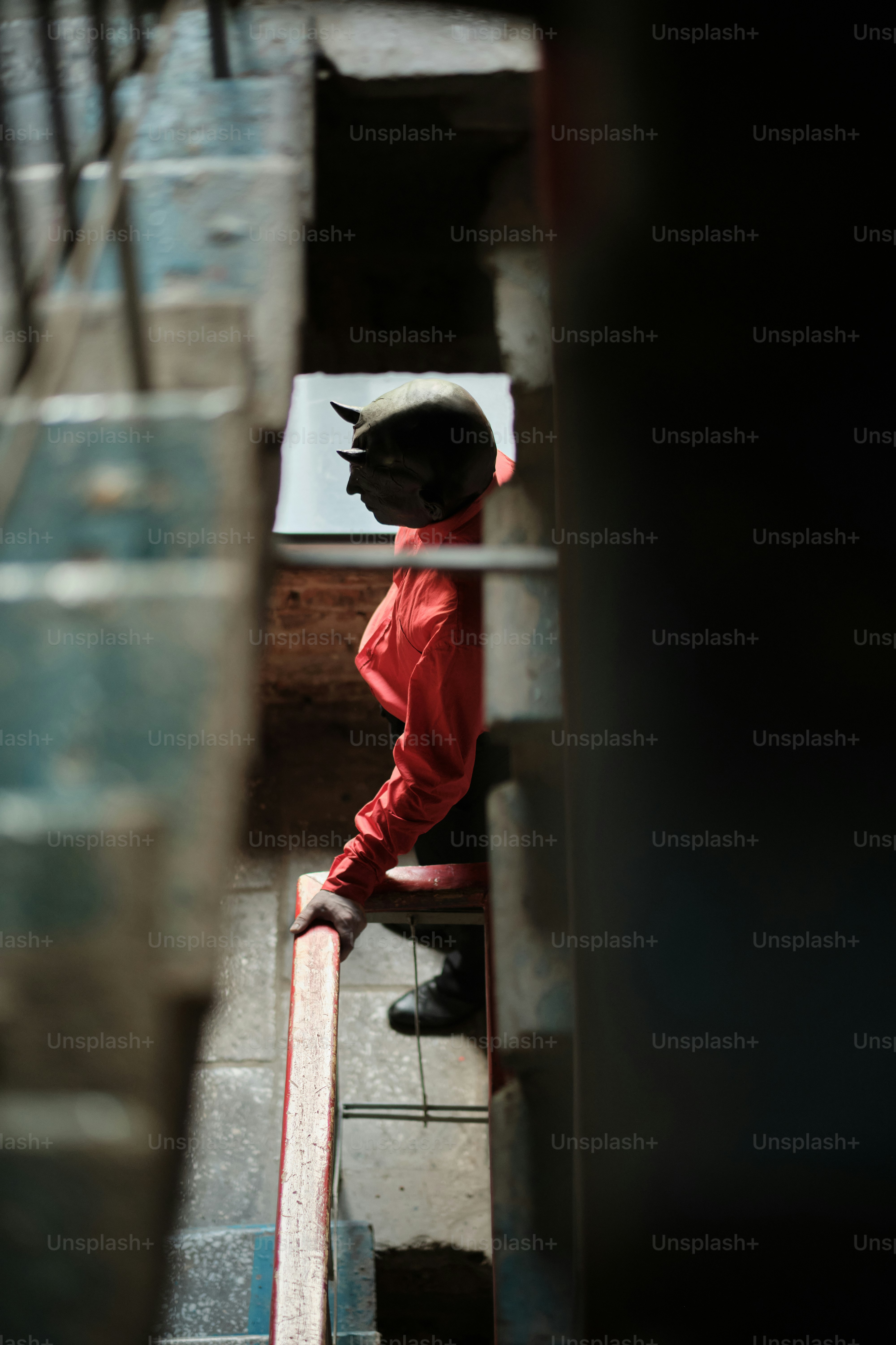 A person sitting on a bench in a room