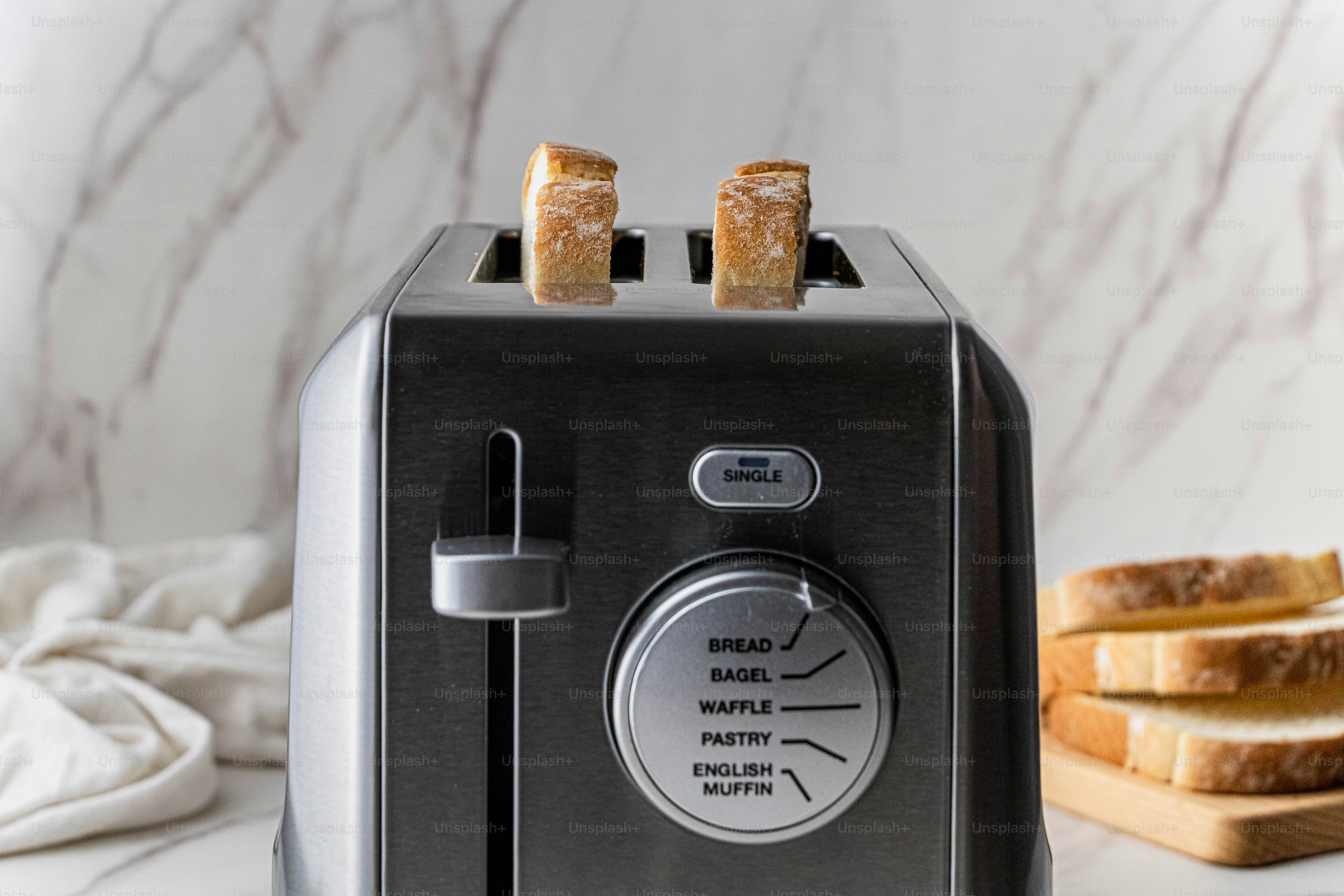 A toaster sitting on top of a white counter photo – Food Image on Unsplash