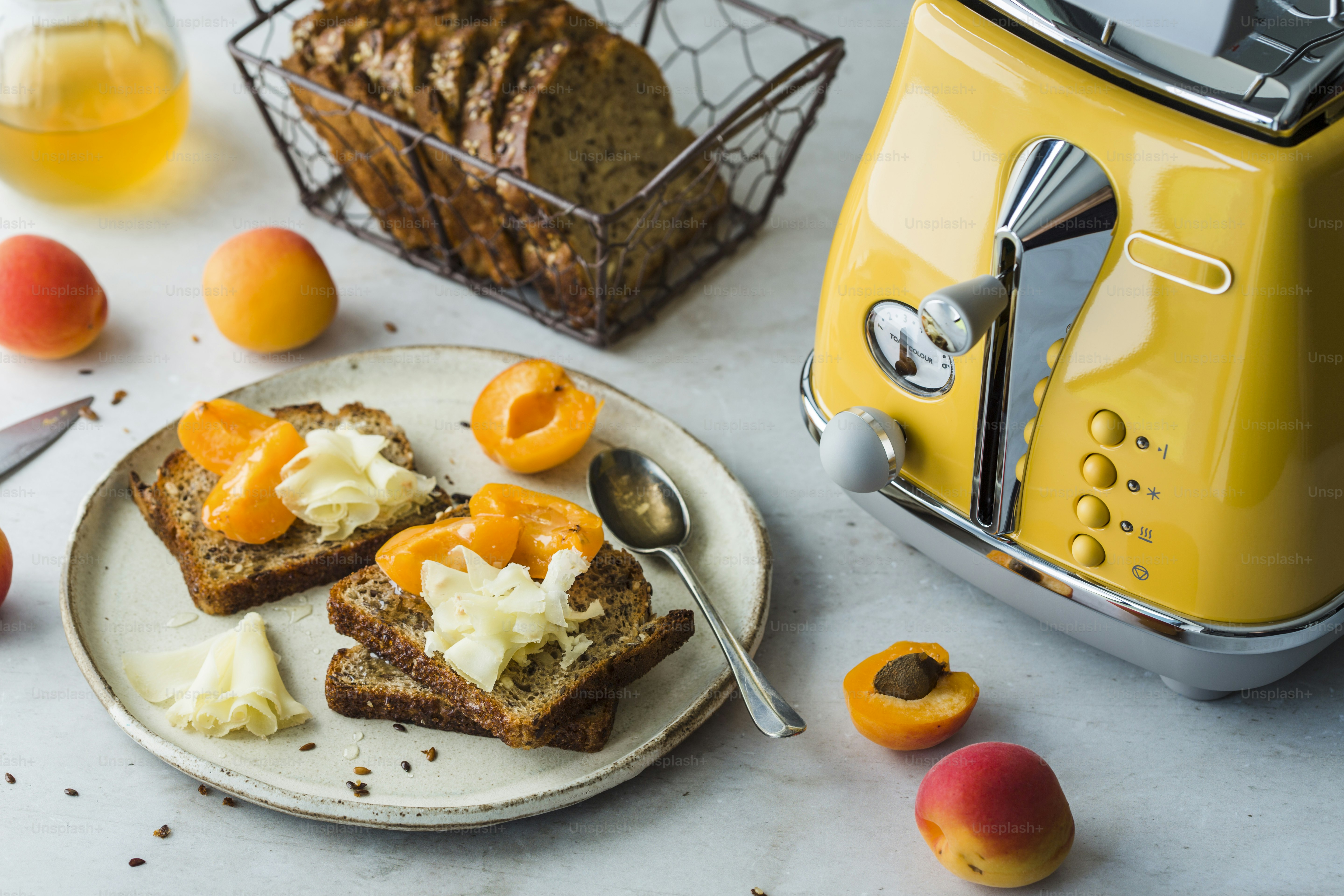 A plate of food with toast and fruit on a table
