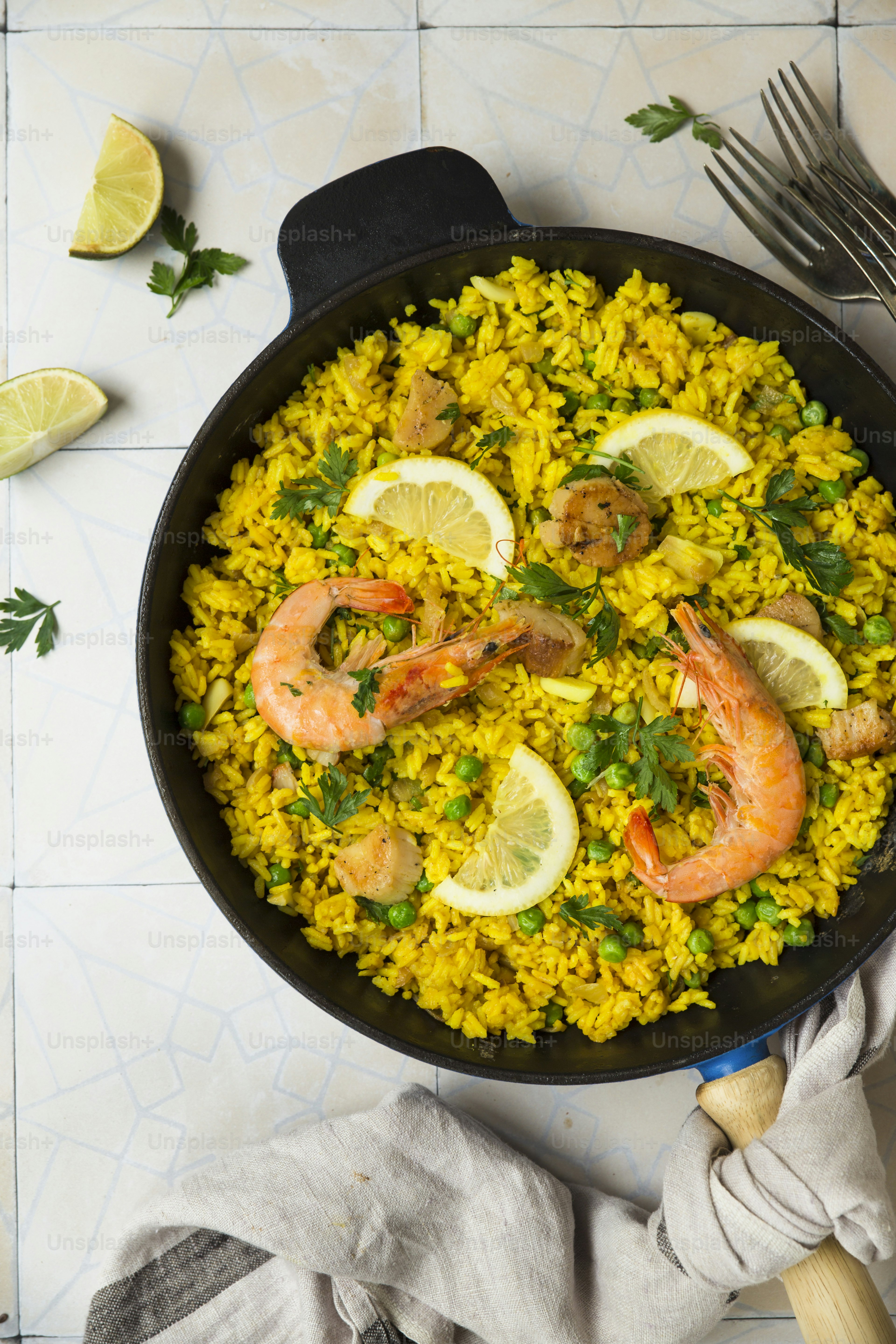 A skillet filled with shrimp and rice