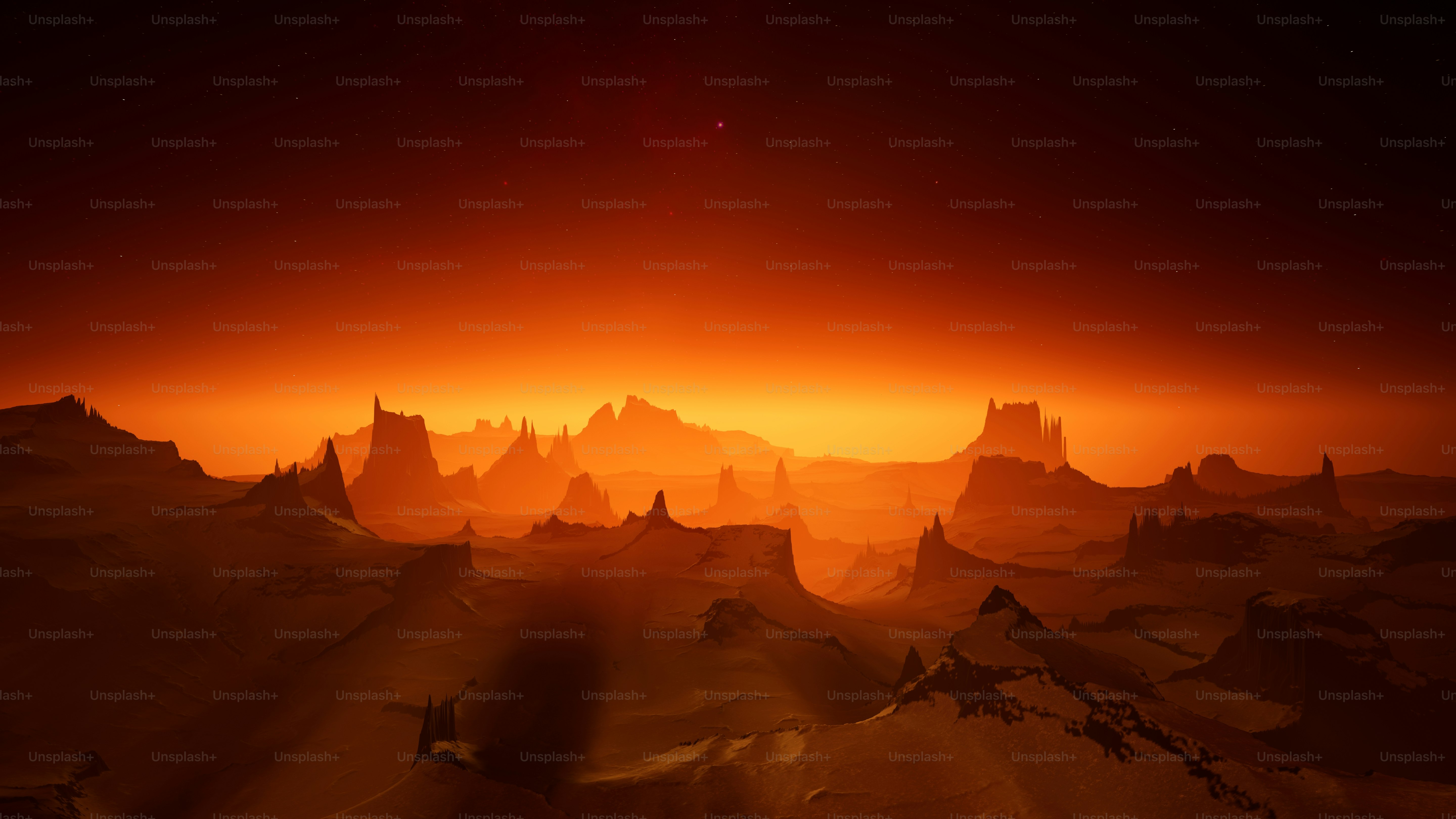 An image of the sun rising over a mountain range