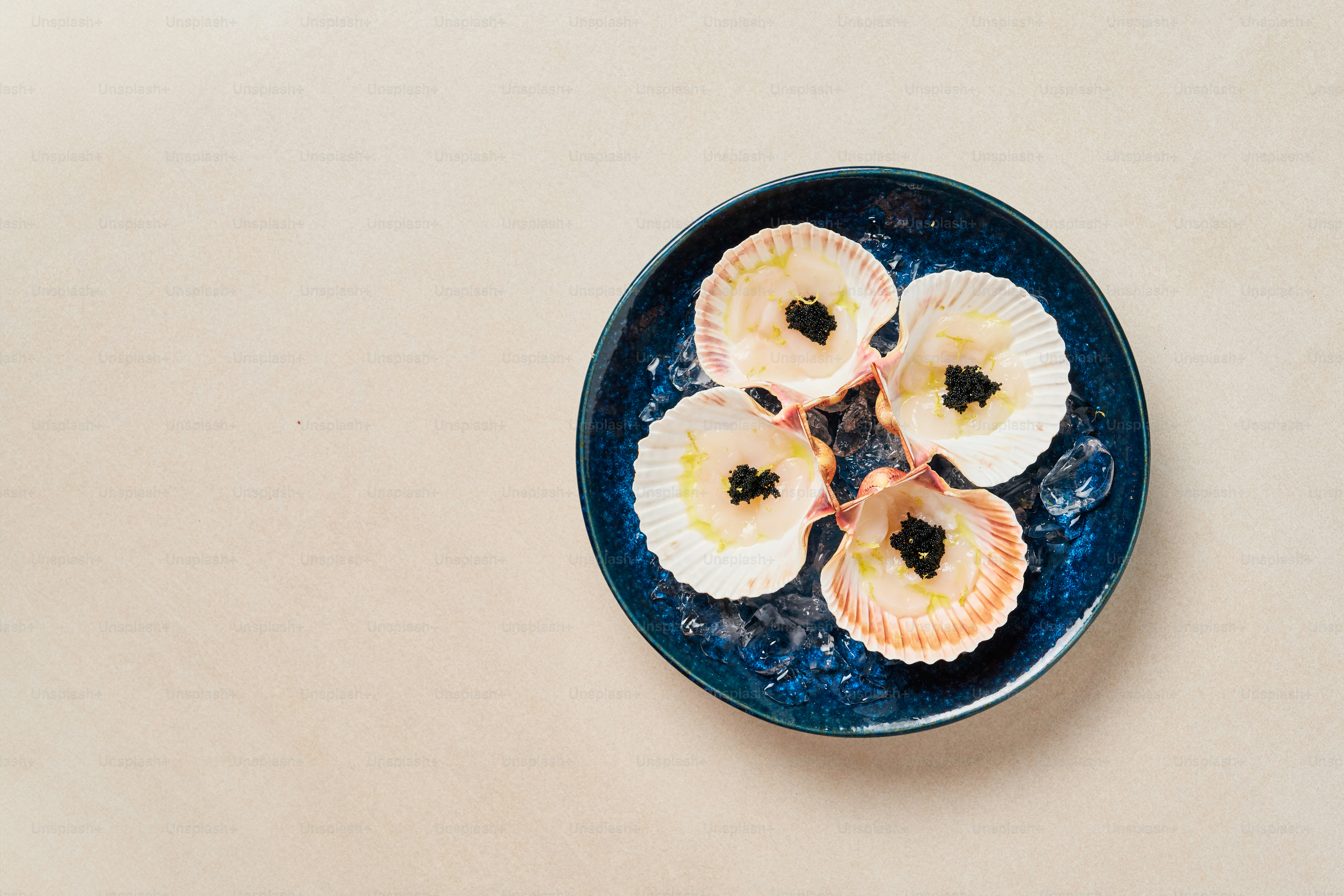 A blue plate topped with sliced fruit on top of a table