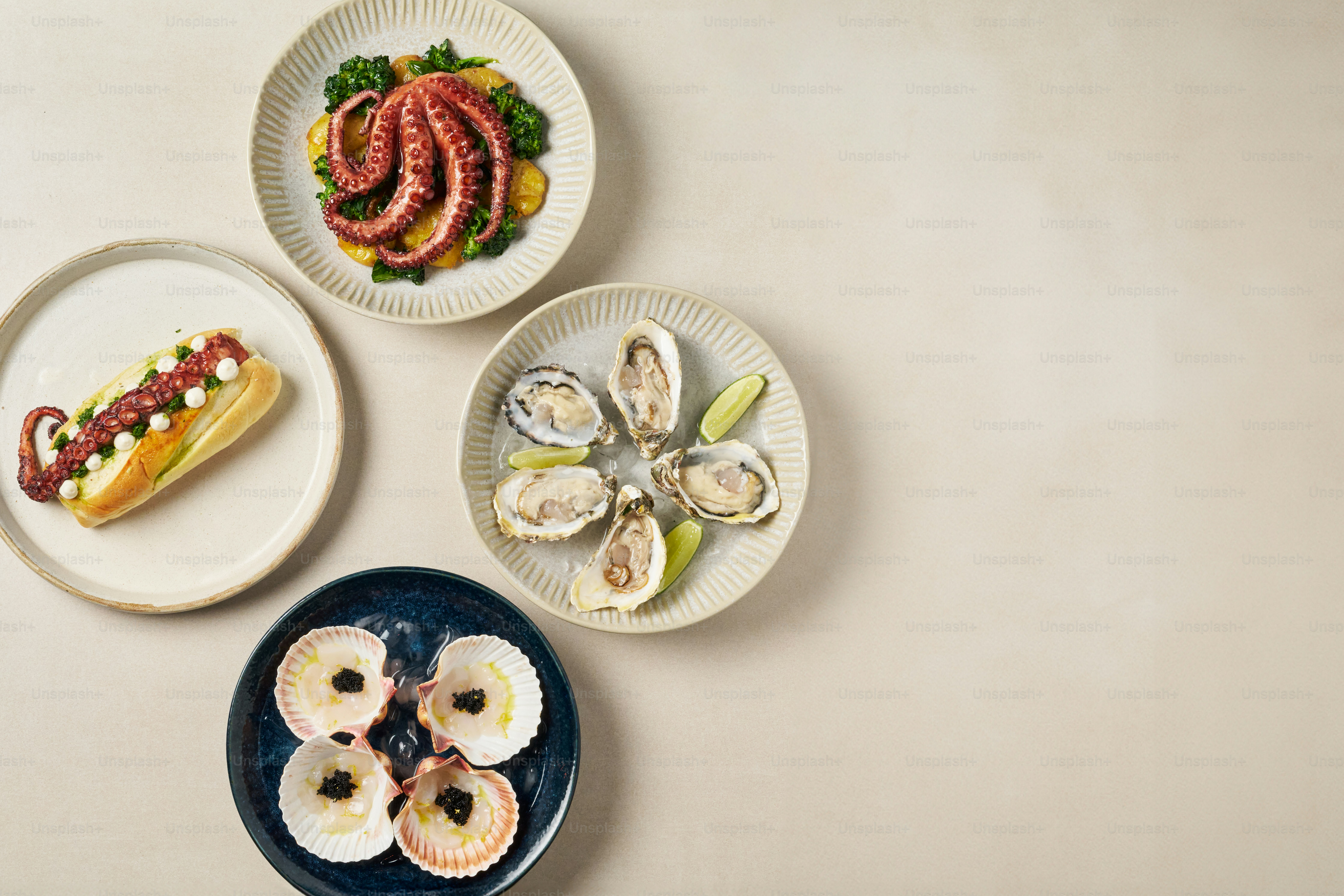 A table topped with plates filled with food