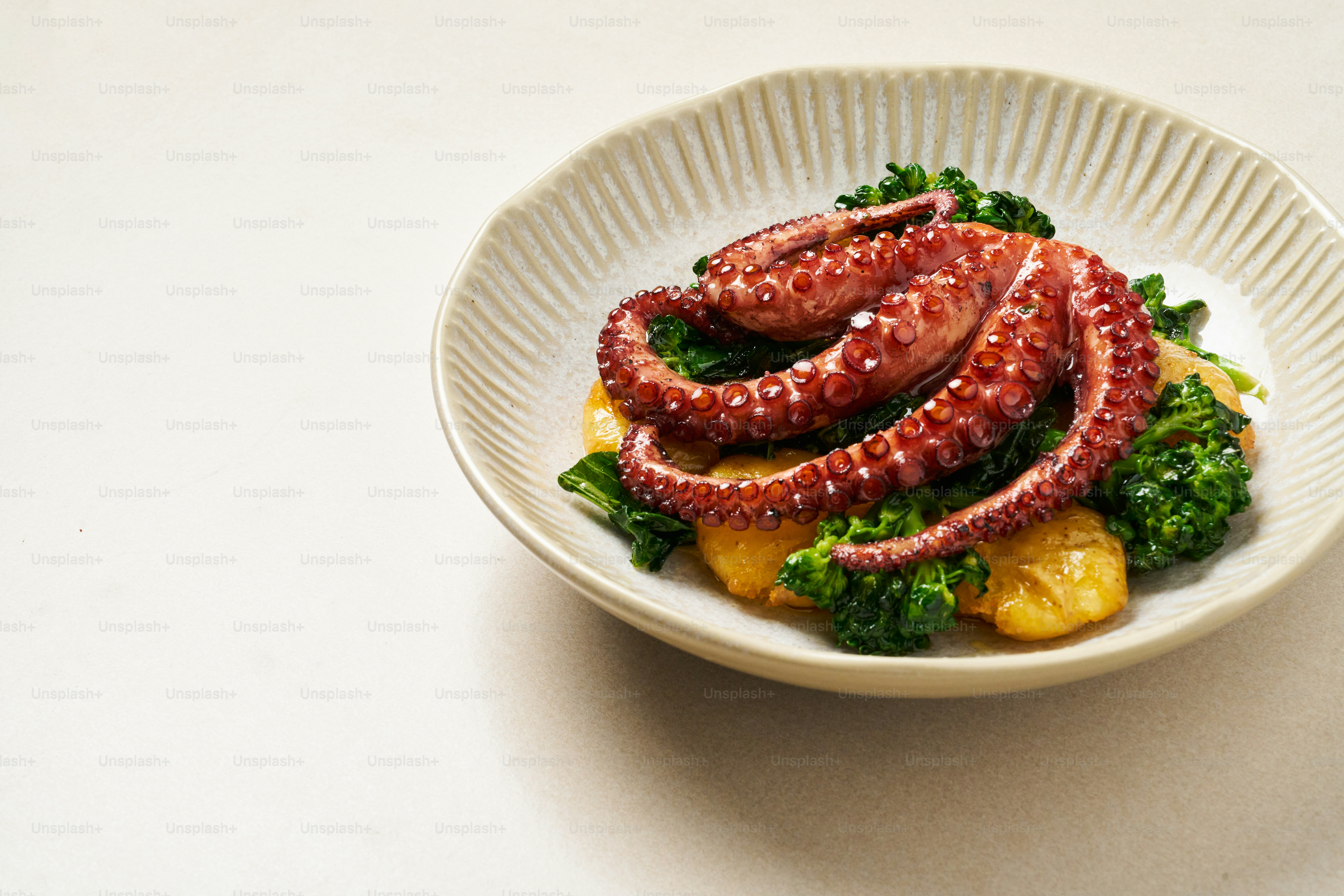 A white bowl filled with food on top of a table
