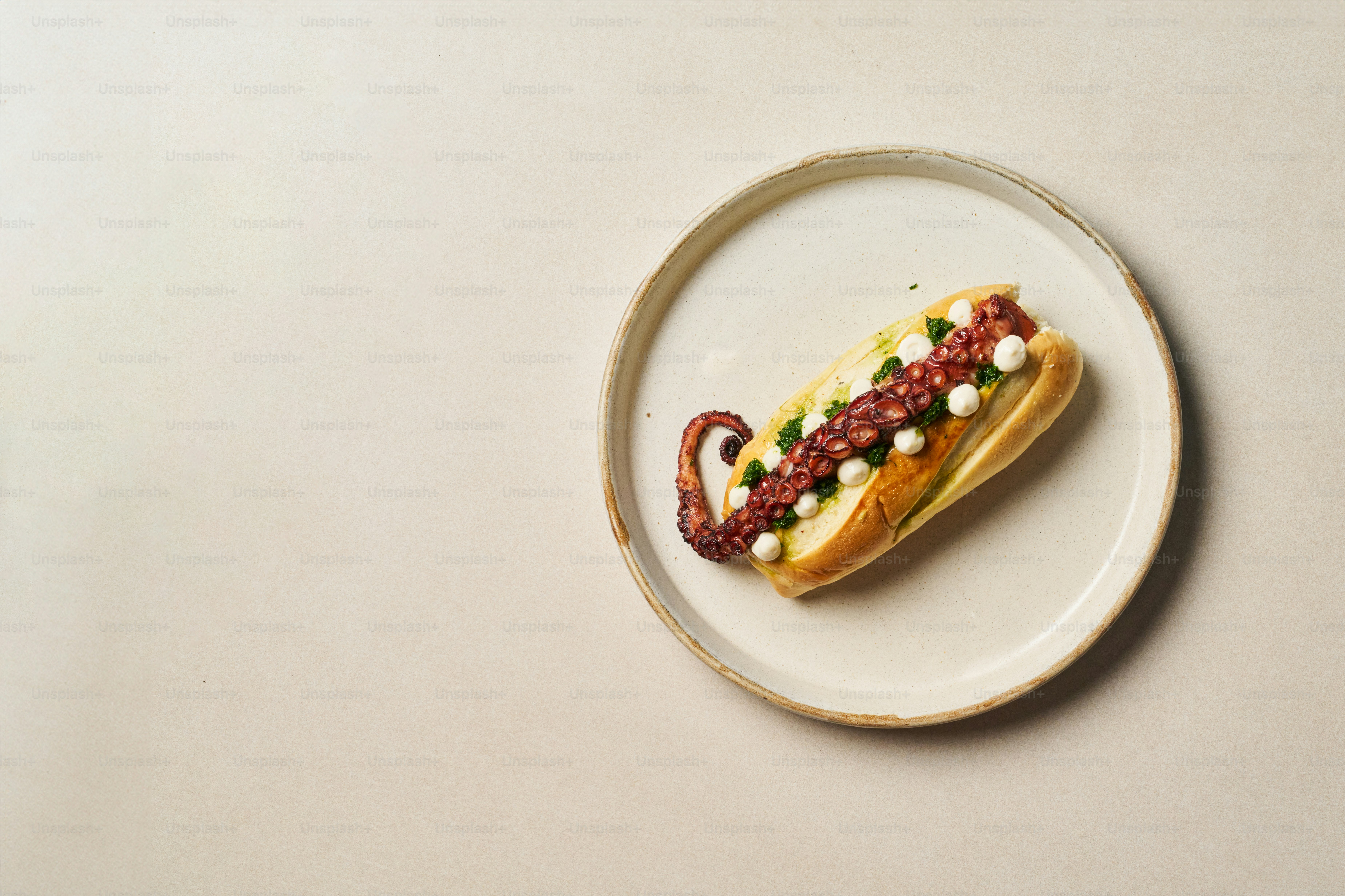A hot dog with mustard and ketchup on a plate