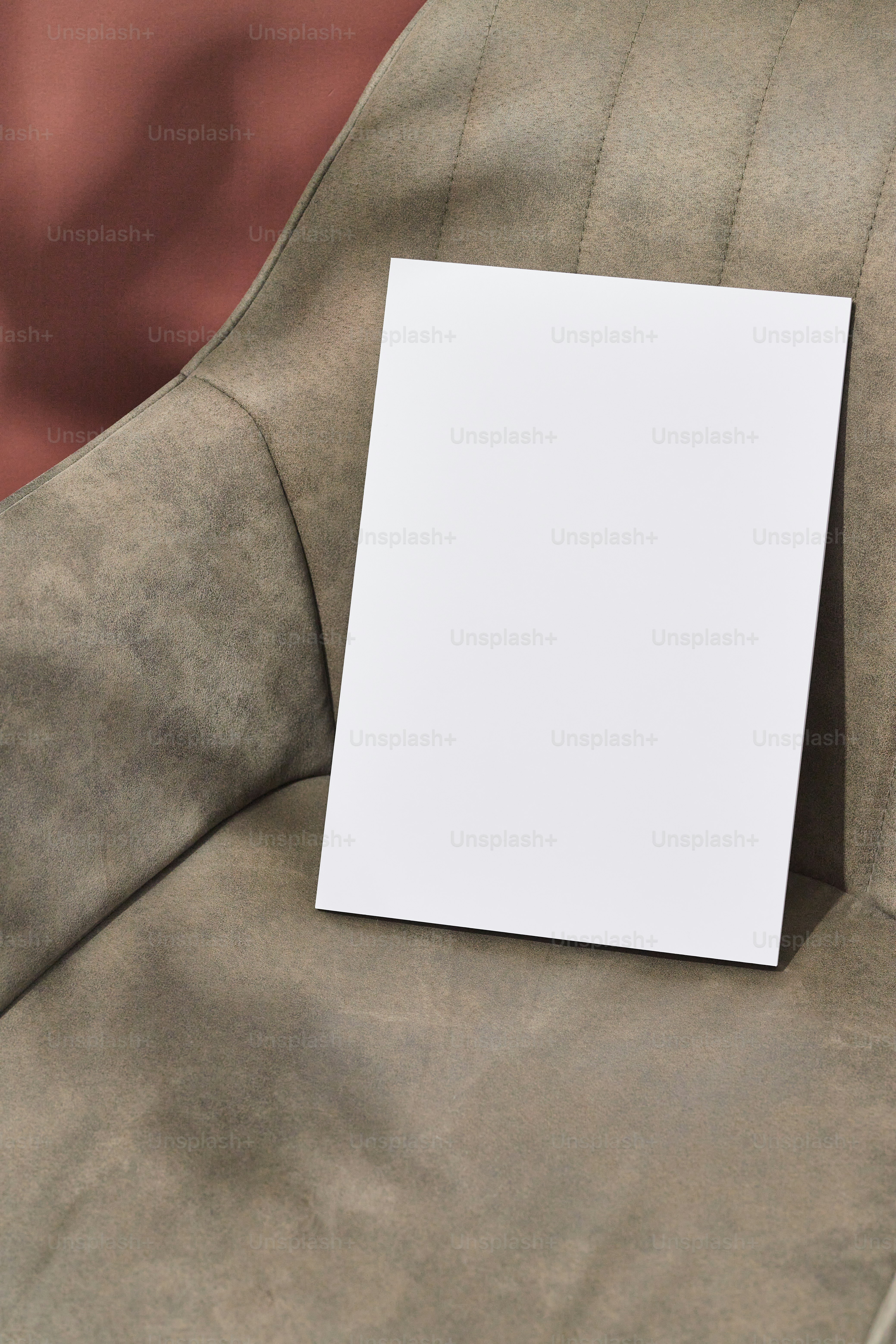 A blank card sitting on top of a chair