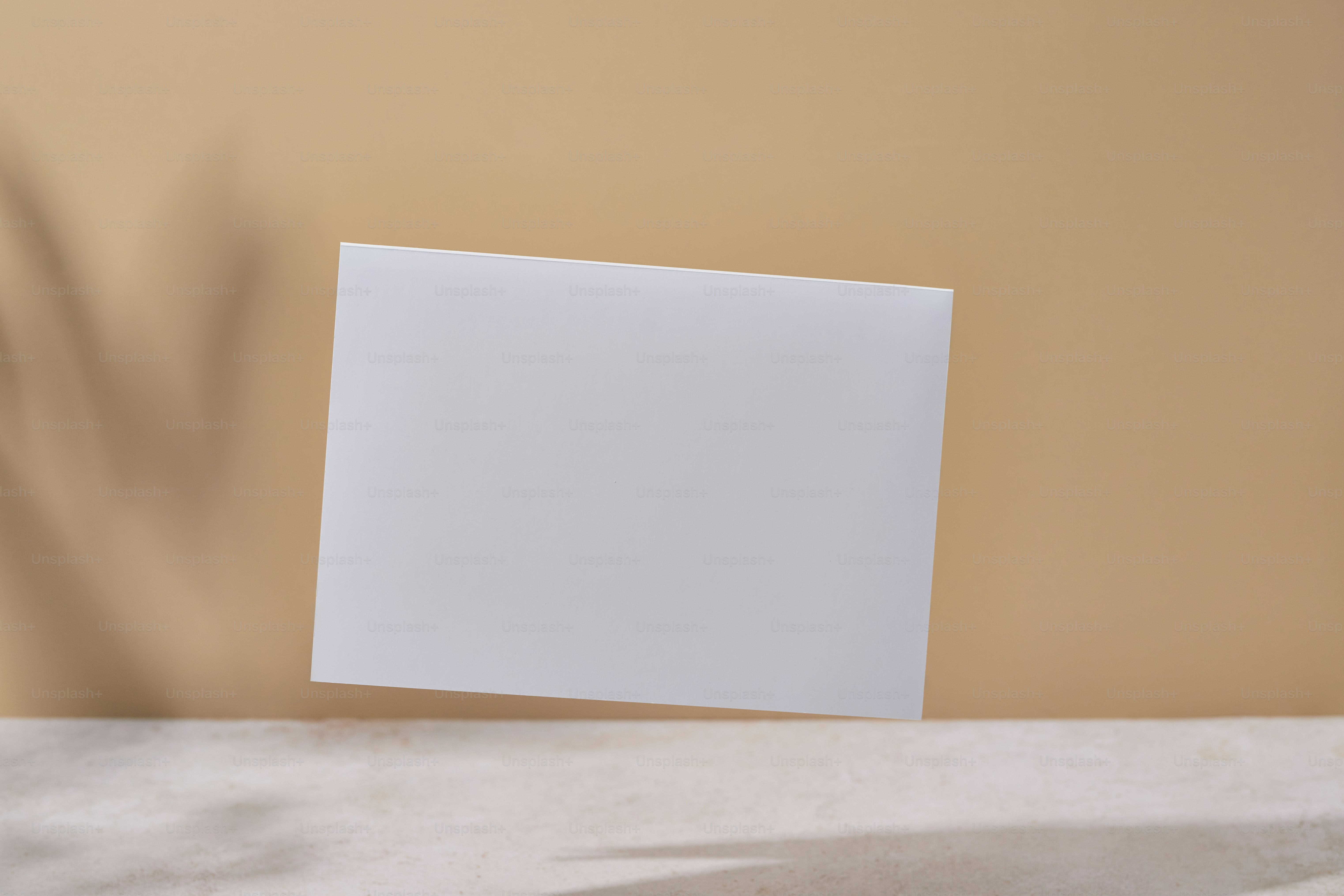 A vase with flowers and a card on a table