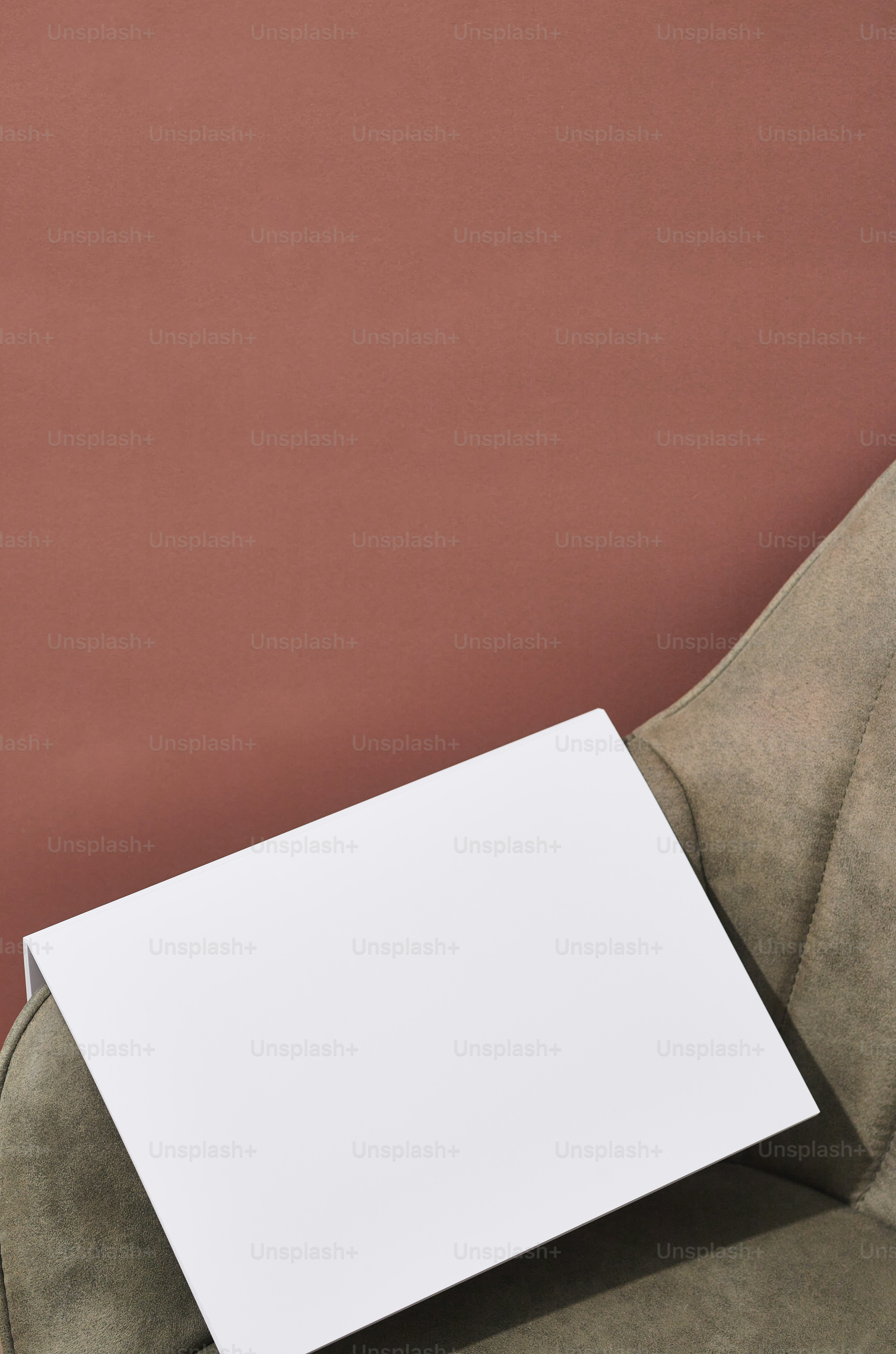 A white piece of paper sticking out of the back of a chair