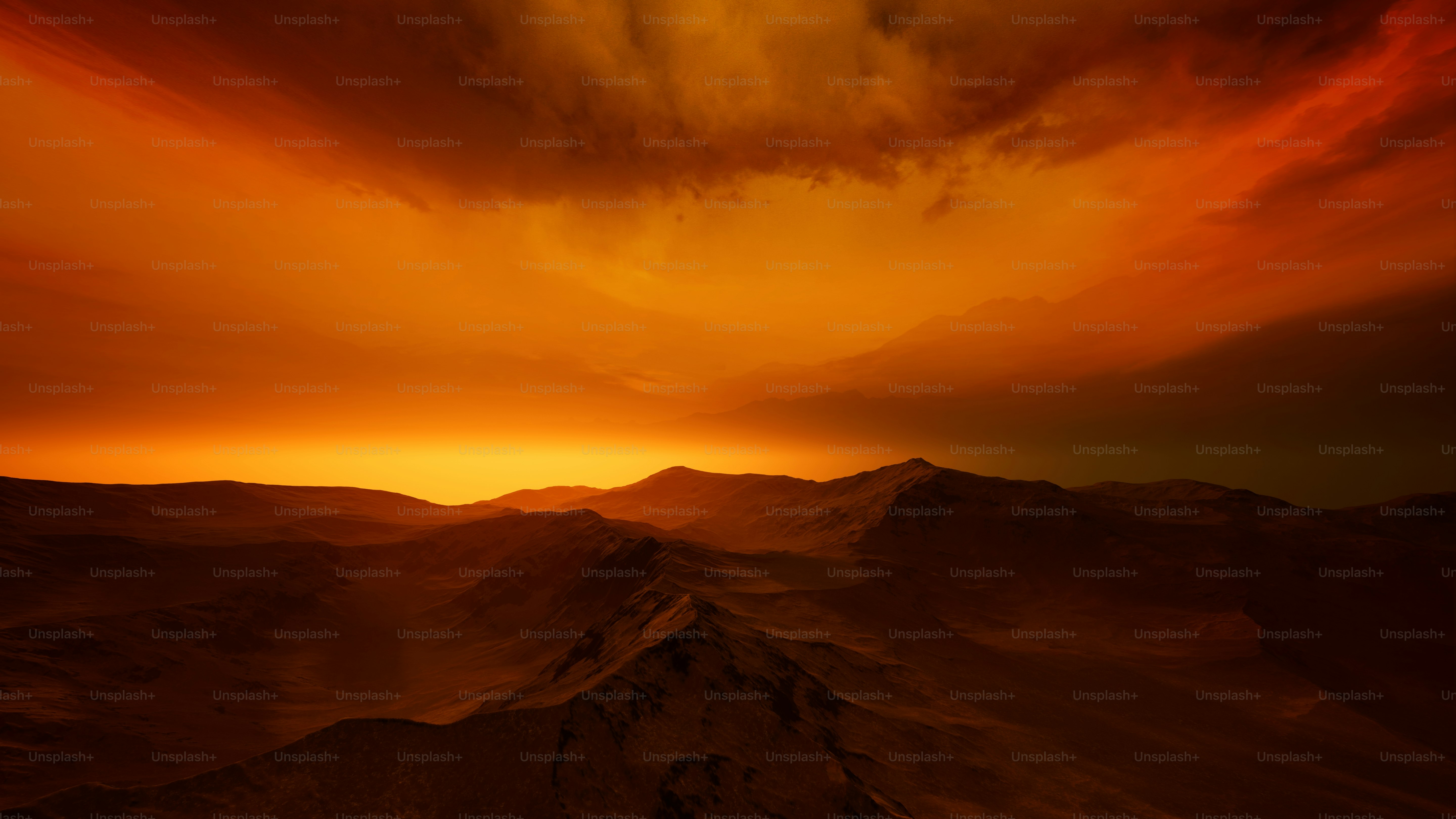 A red and yellow sky over a mountain range