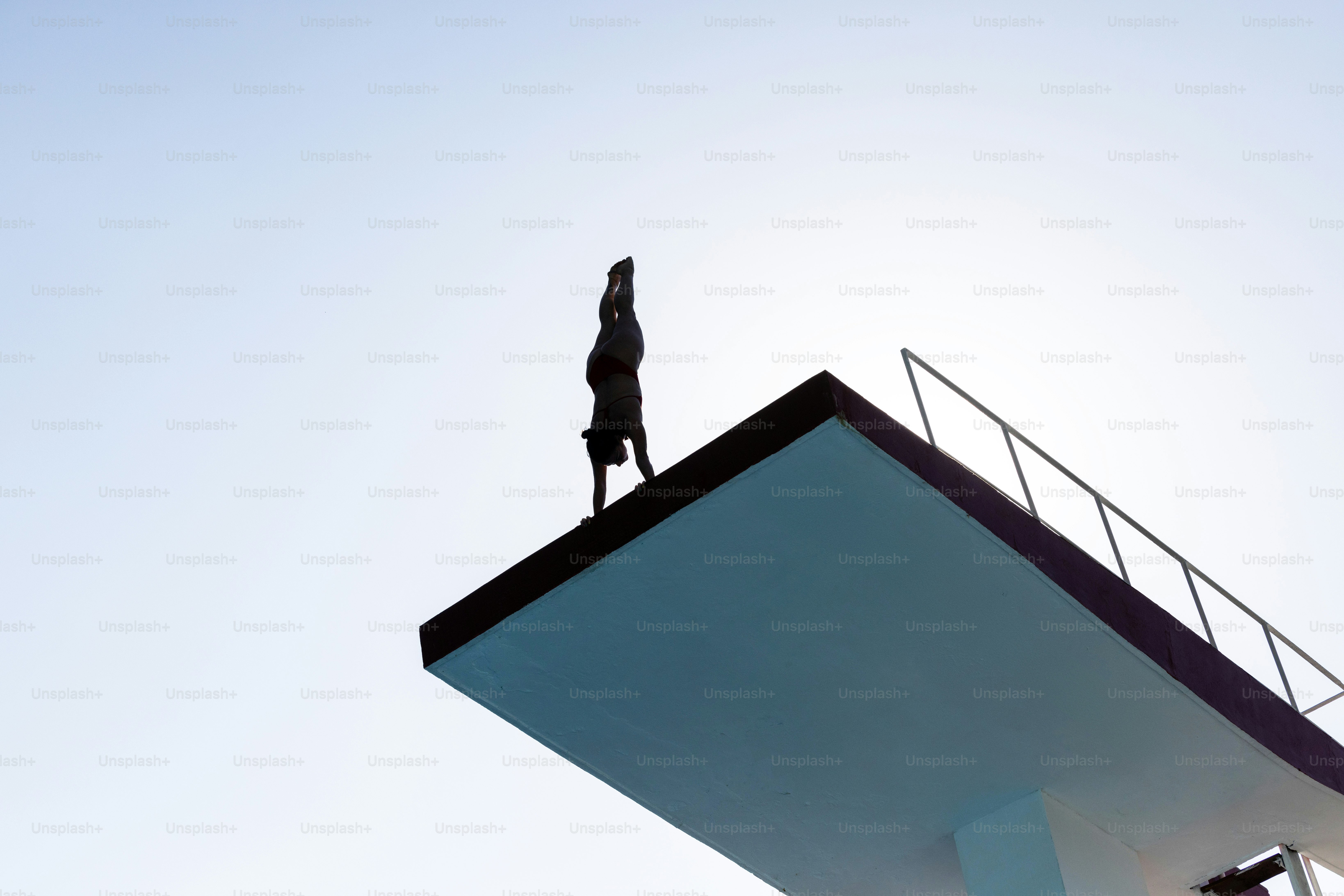 A person standing on top of a tall building