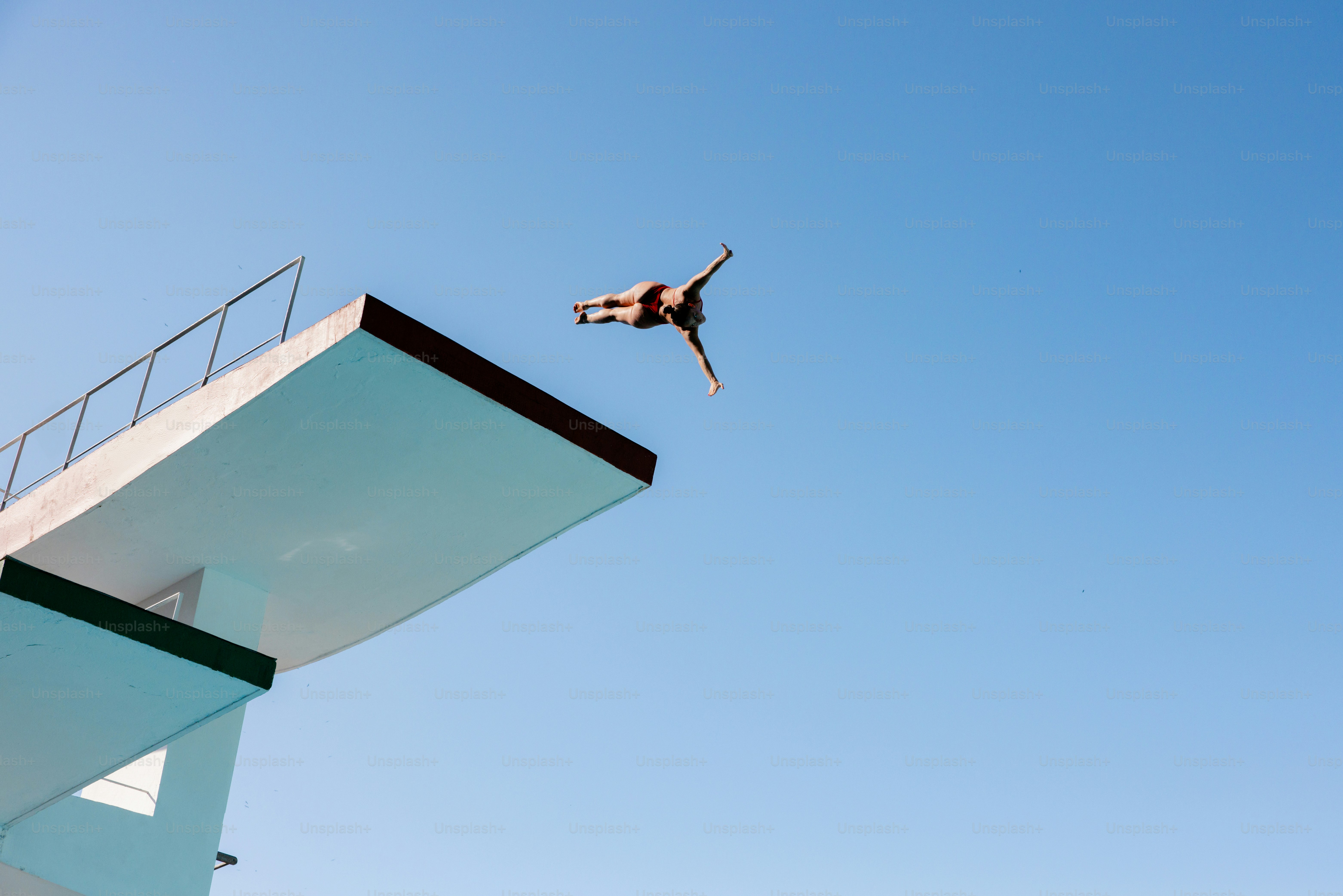 A man flying through the air while riding a skateboard