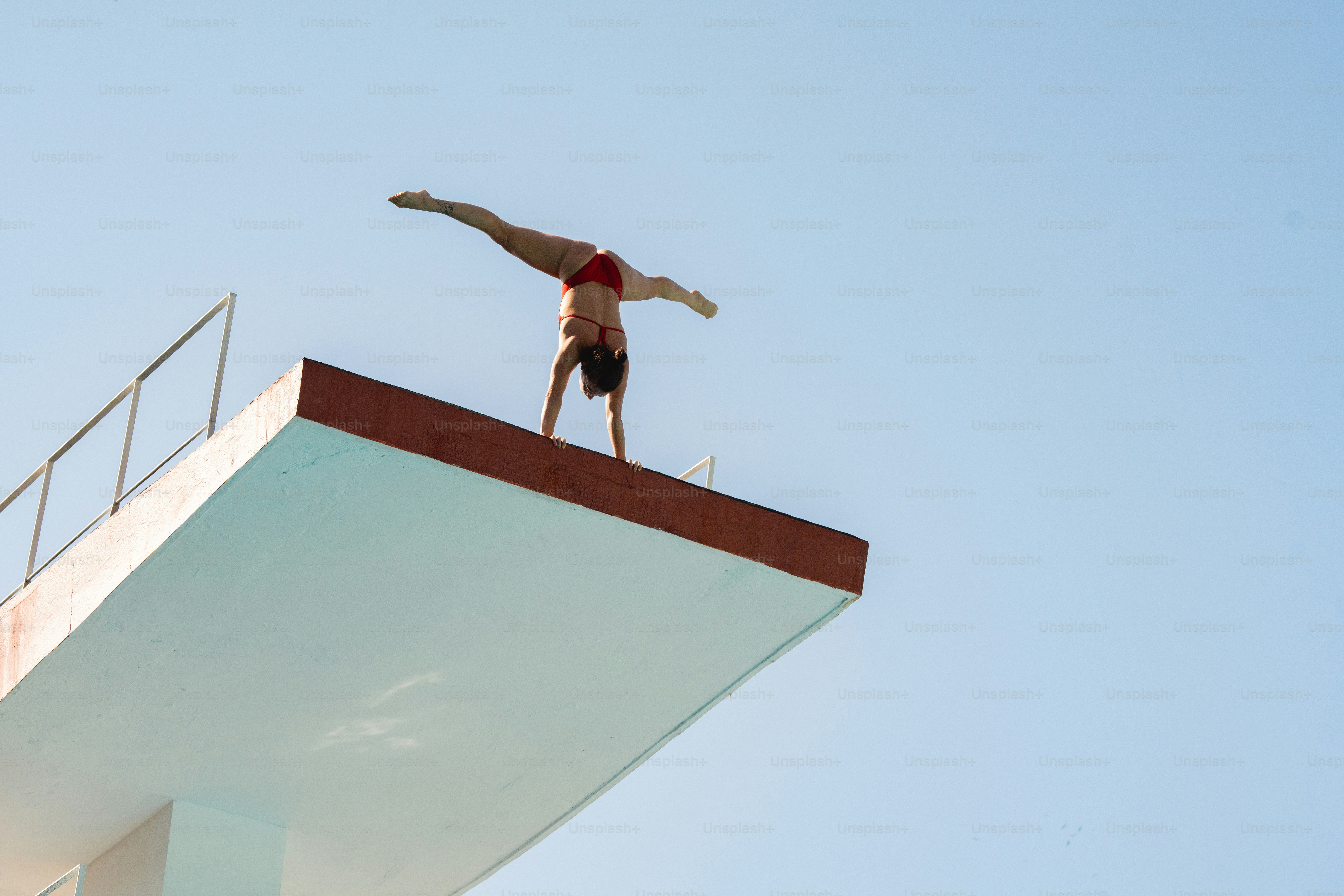 A man standing on top of a tall building