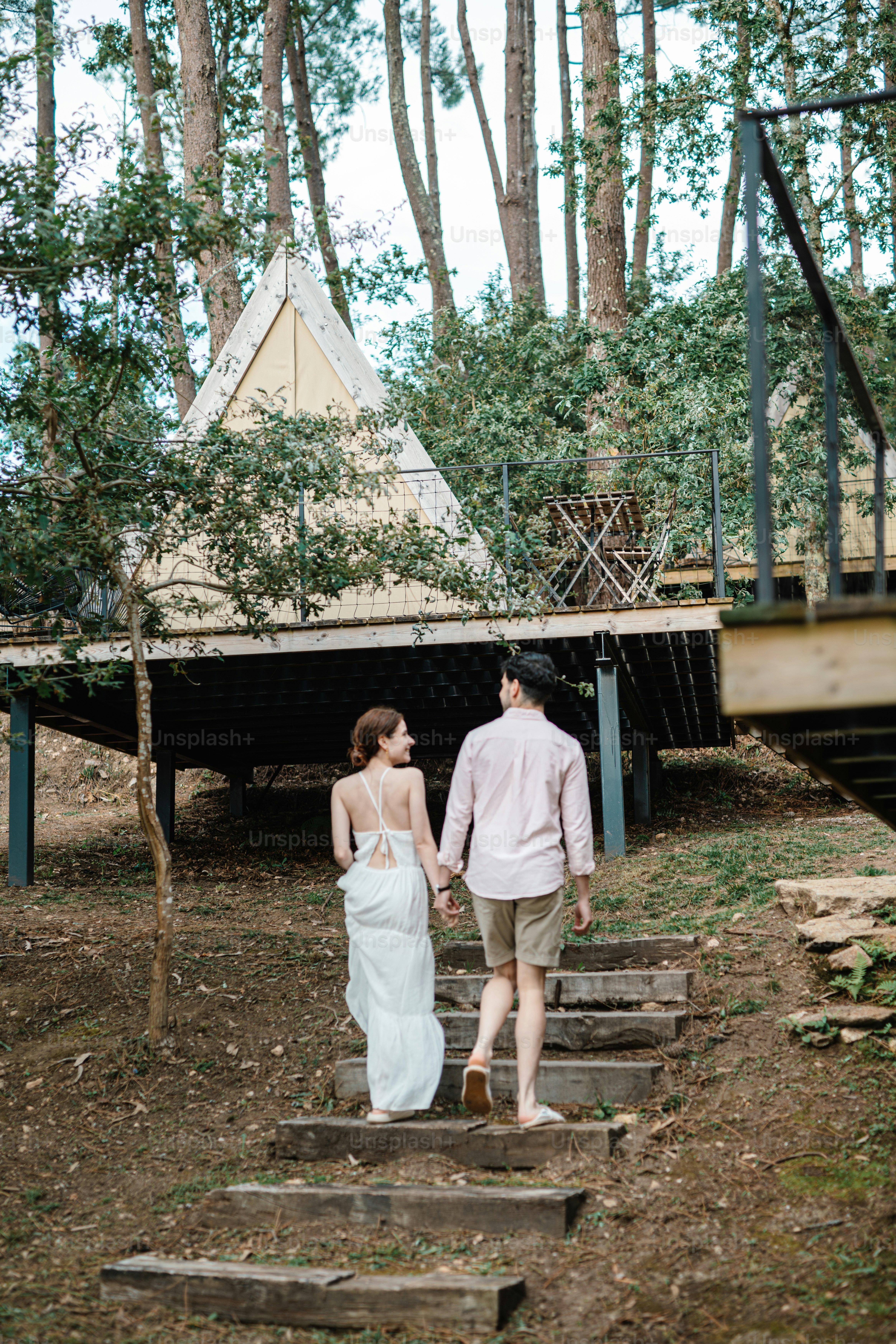A man and a woman walking down some steps
