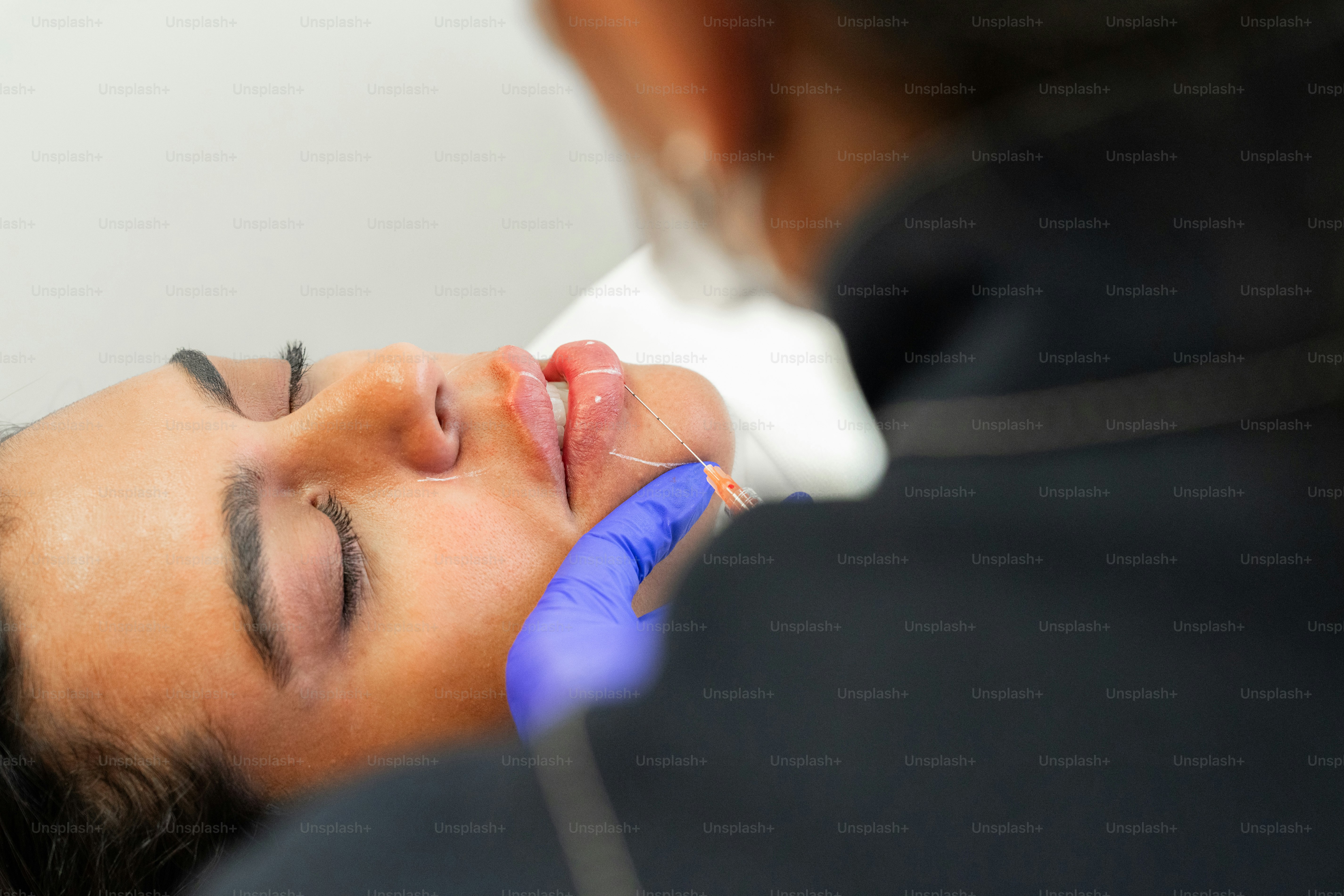 A woman getting a facial procedure on her face