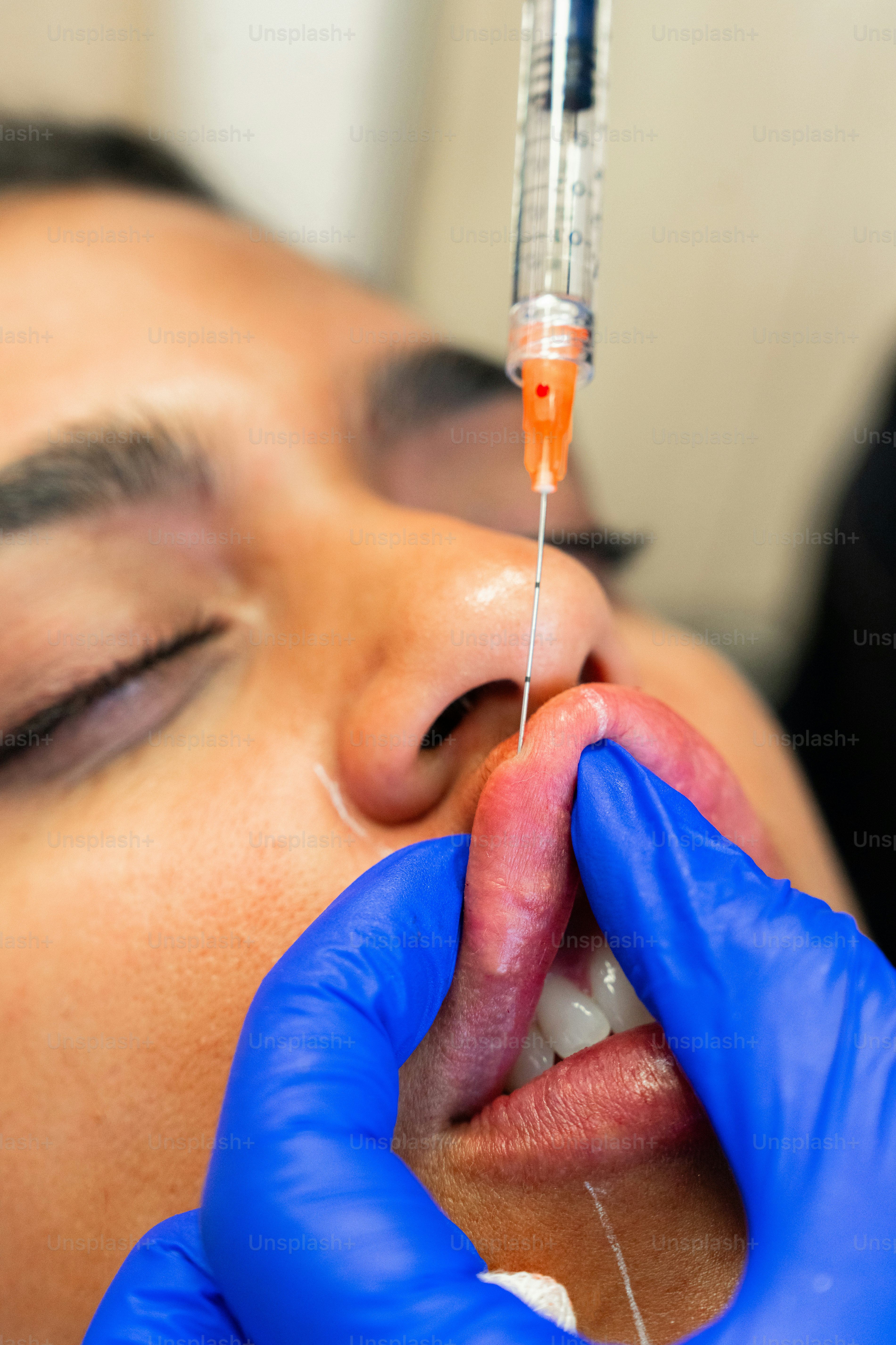 A woman getting an injection from a doctor