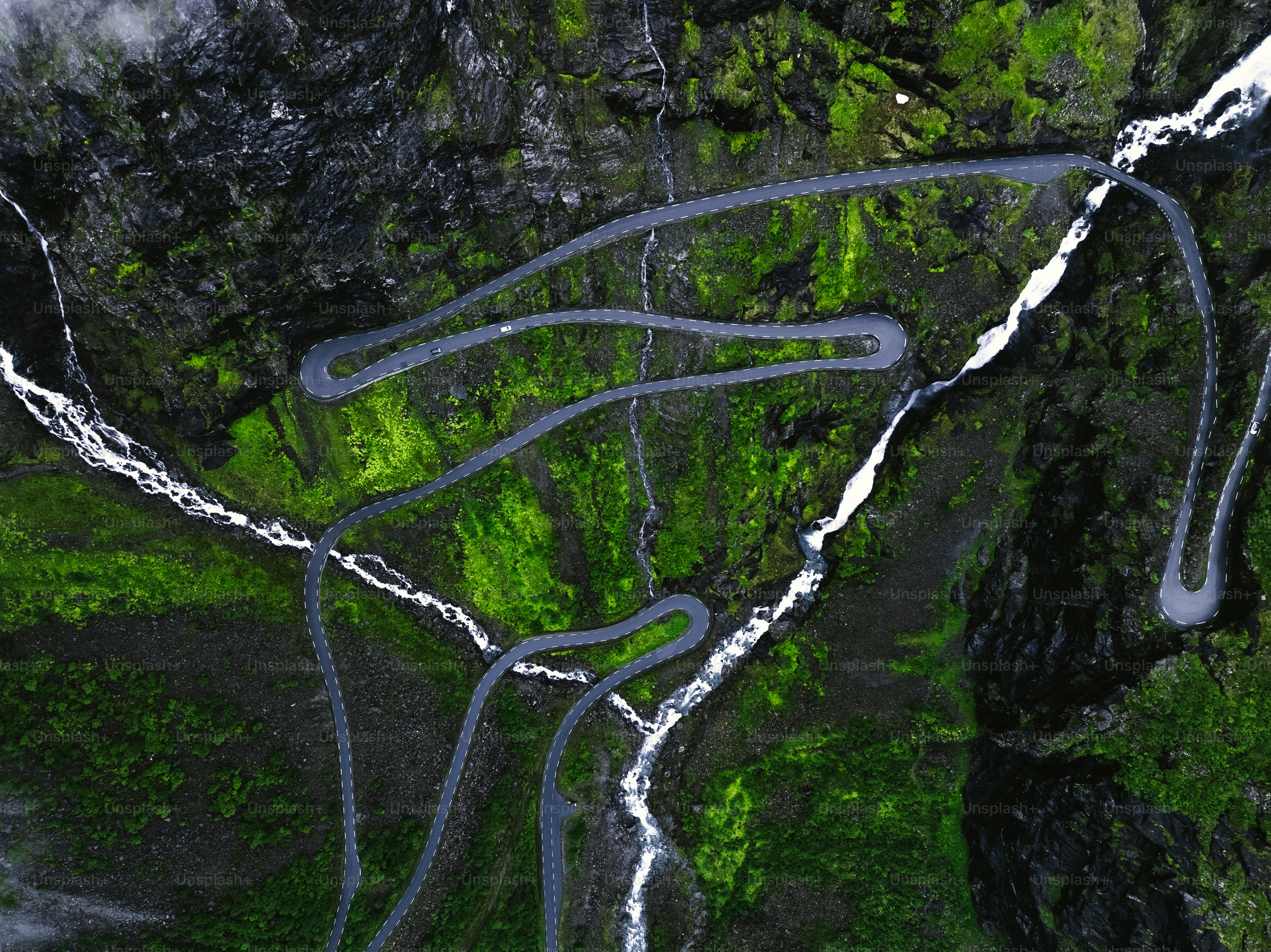 An aerial view of a winding mountain road