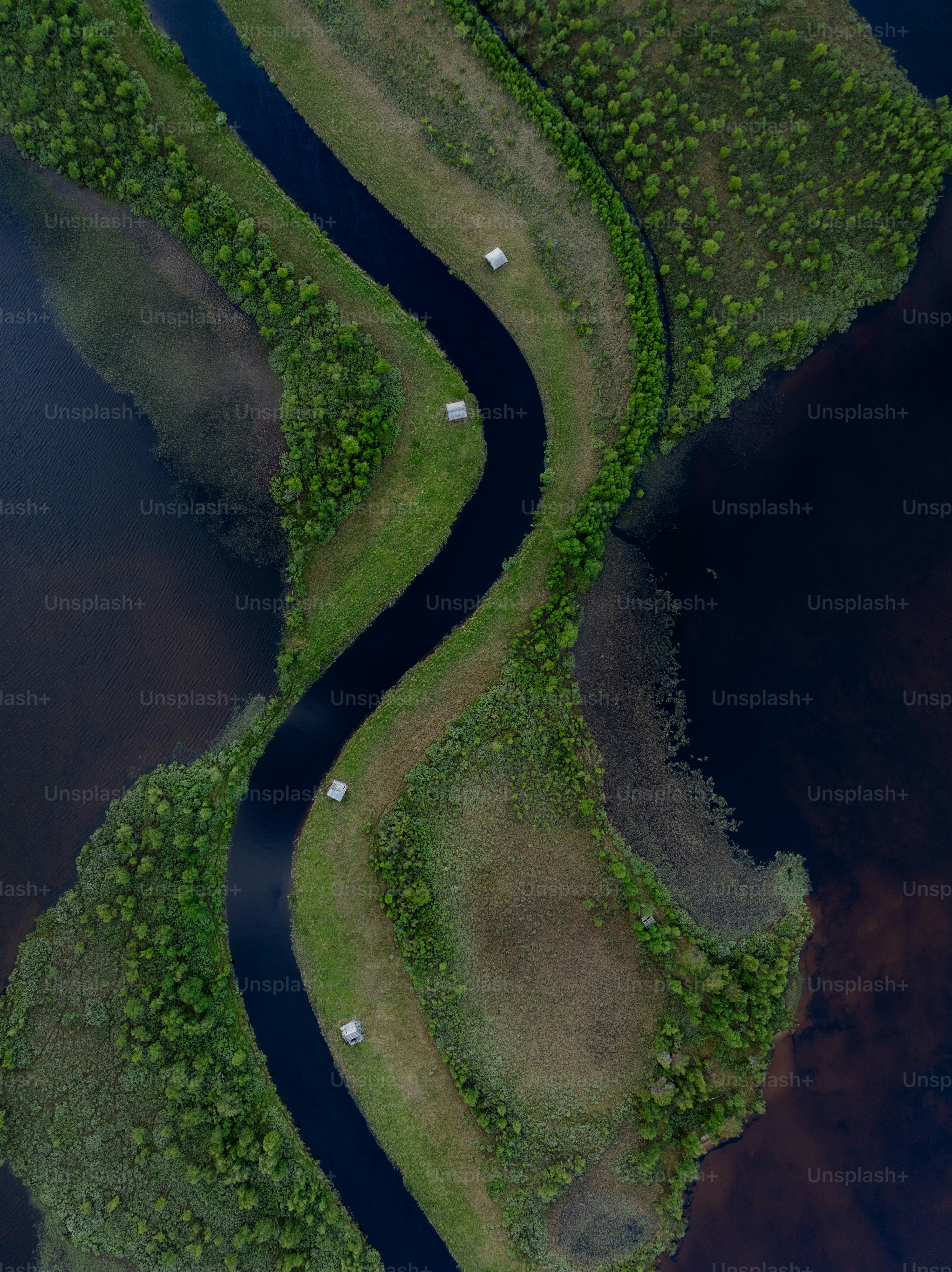 A river running through a lush green countryside