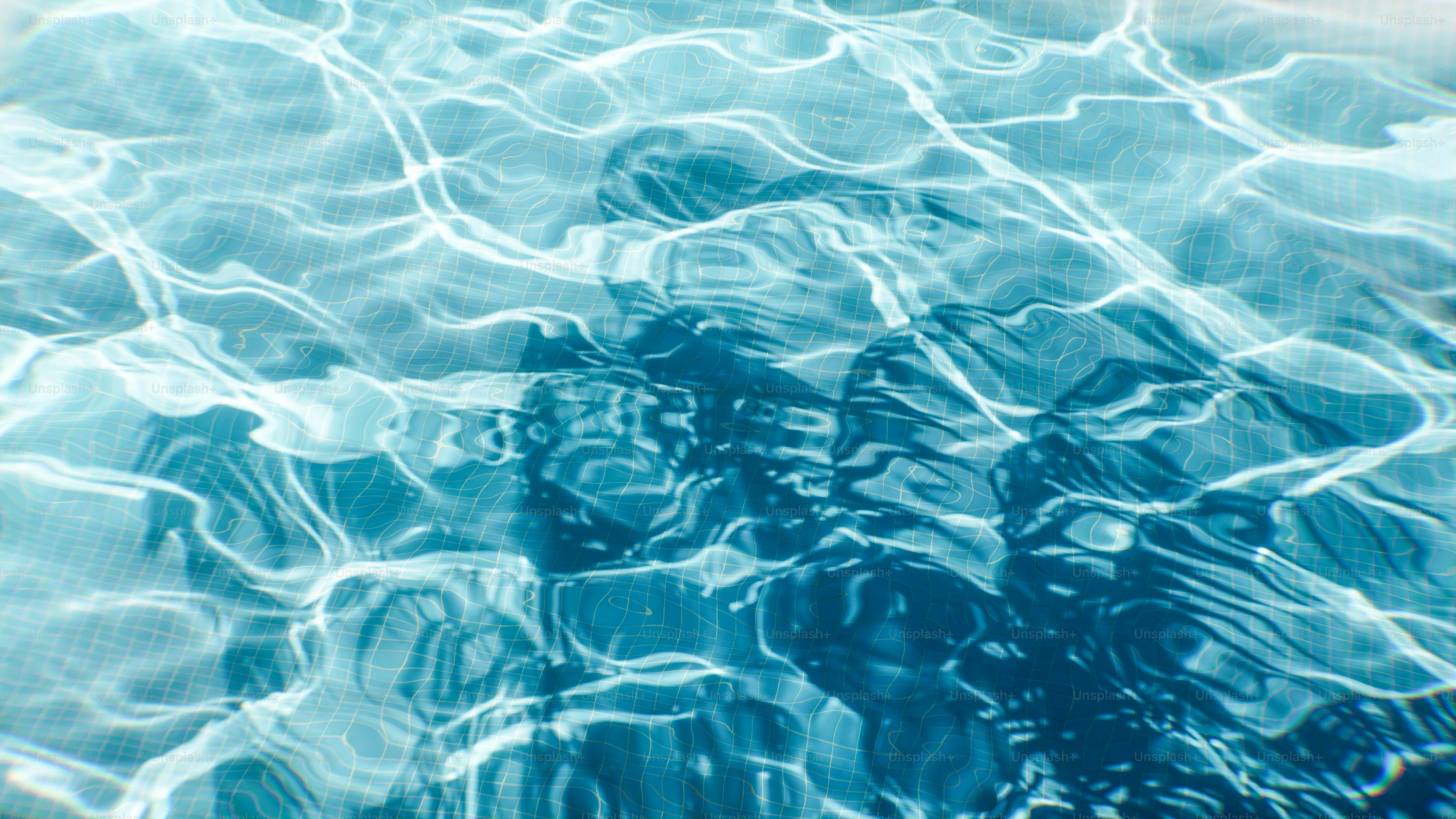 A pool of water with a blue sky in the background