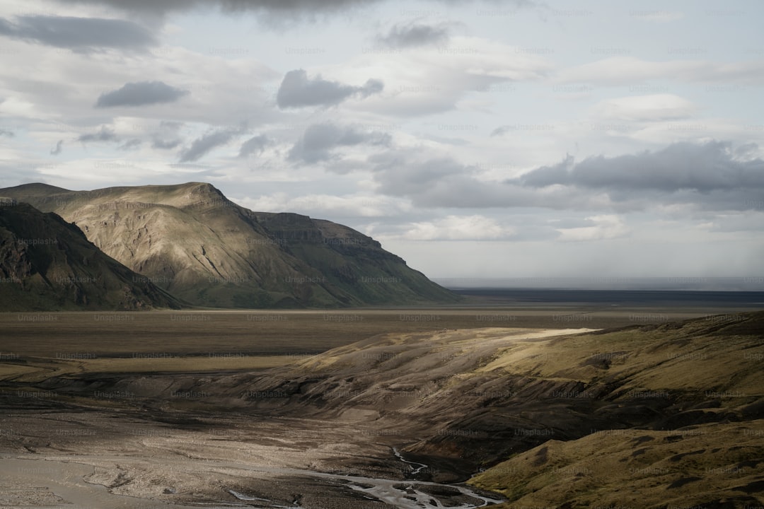 A mountain range with a river running through it