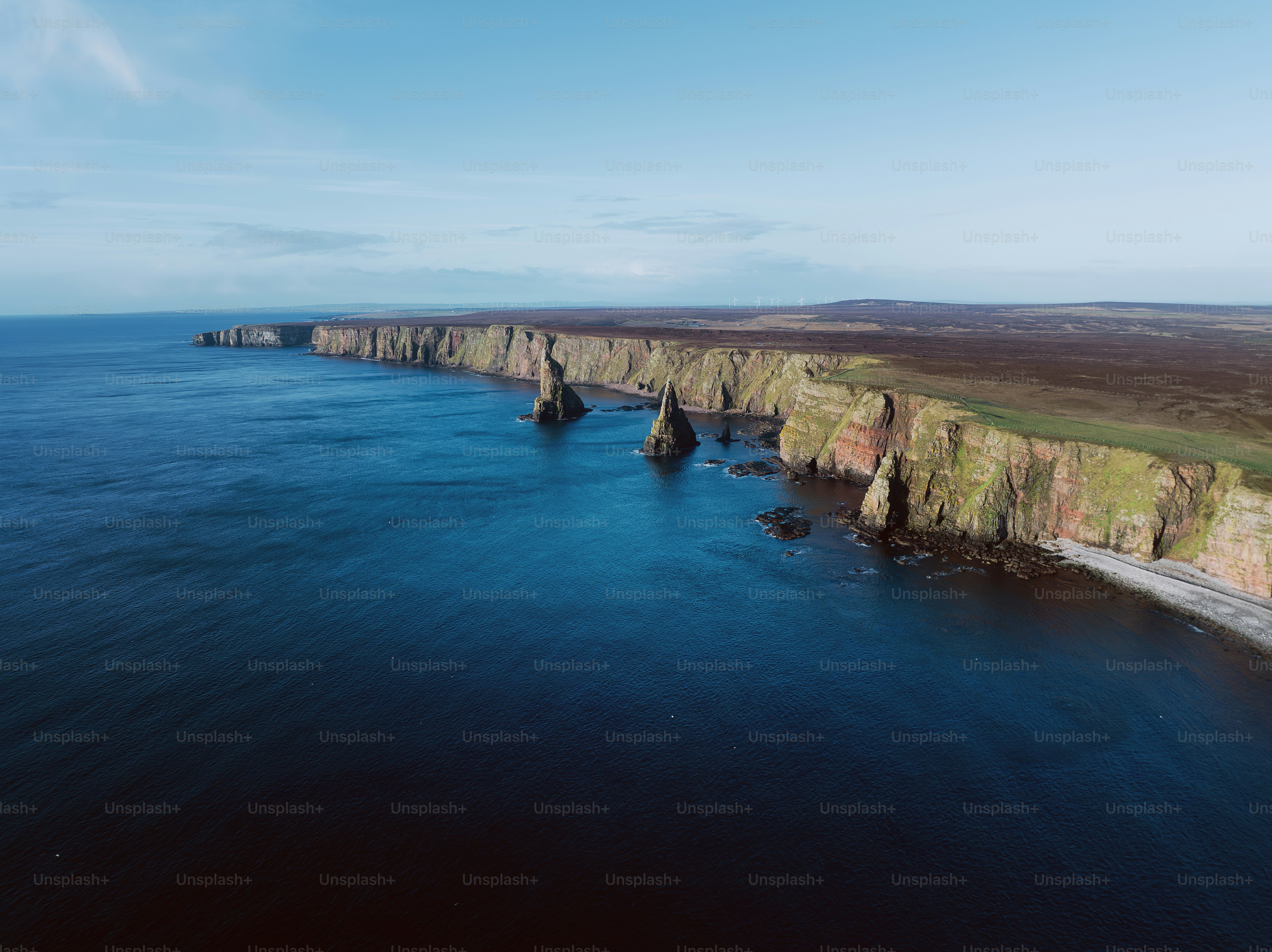 A large body of water surrounded by cliffs