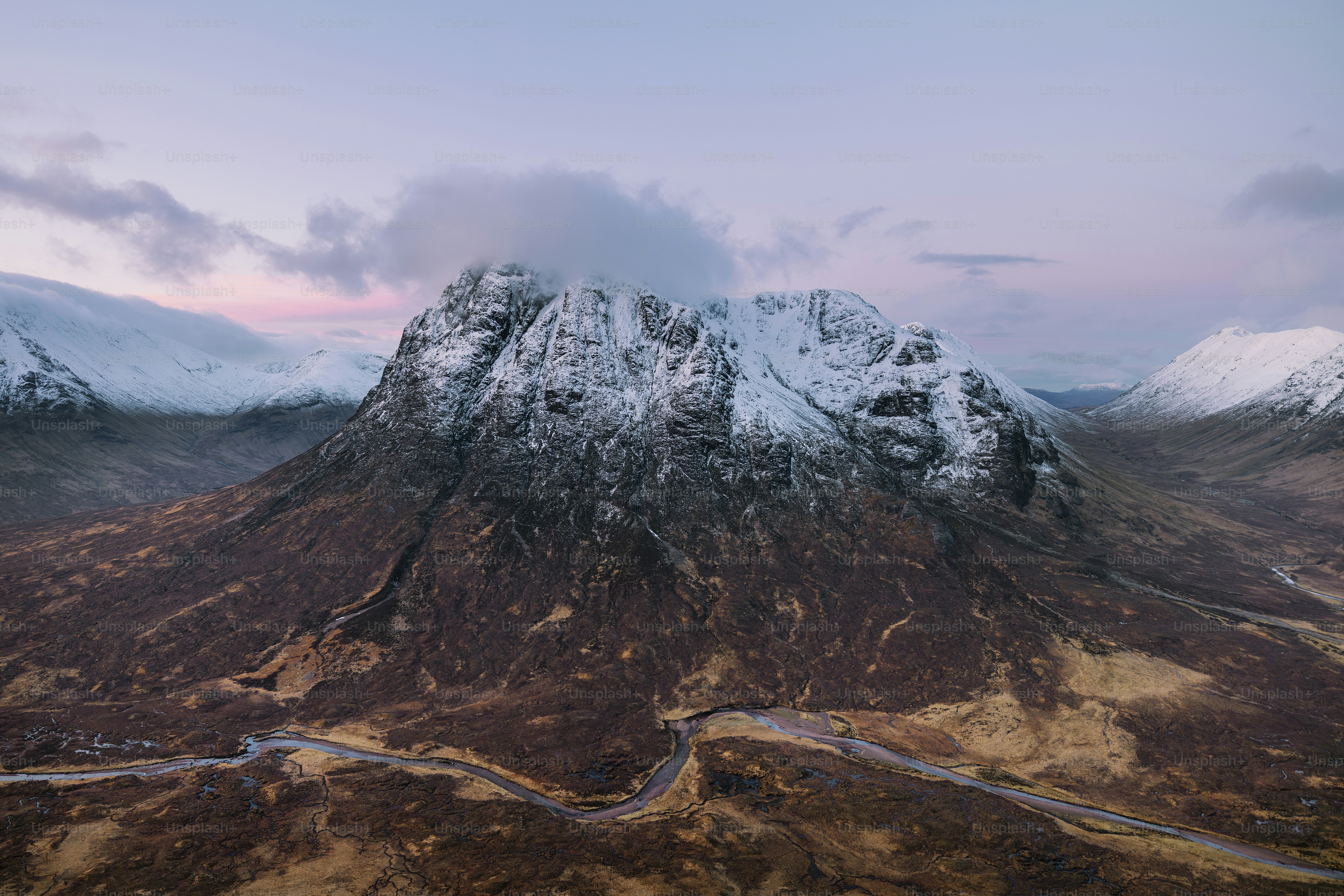An aerial view of a snow covered mountain