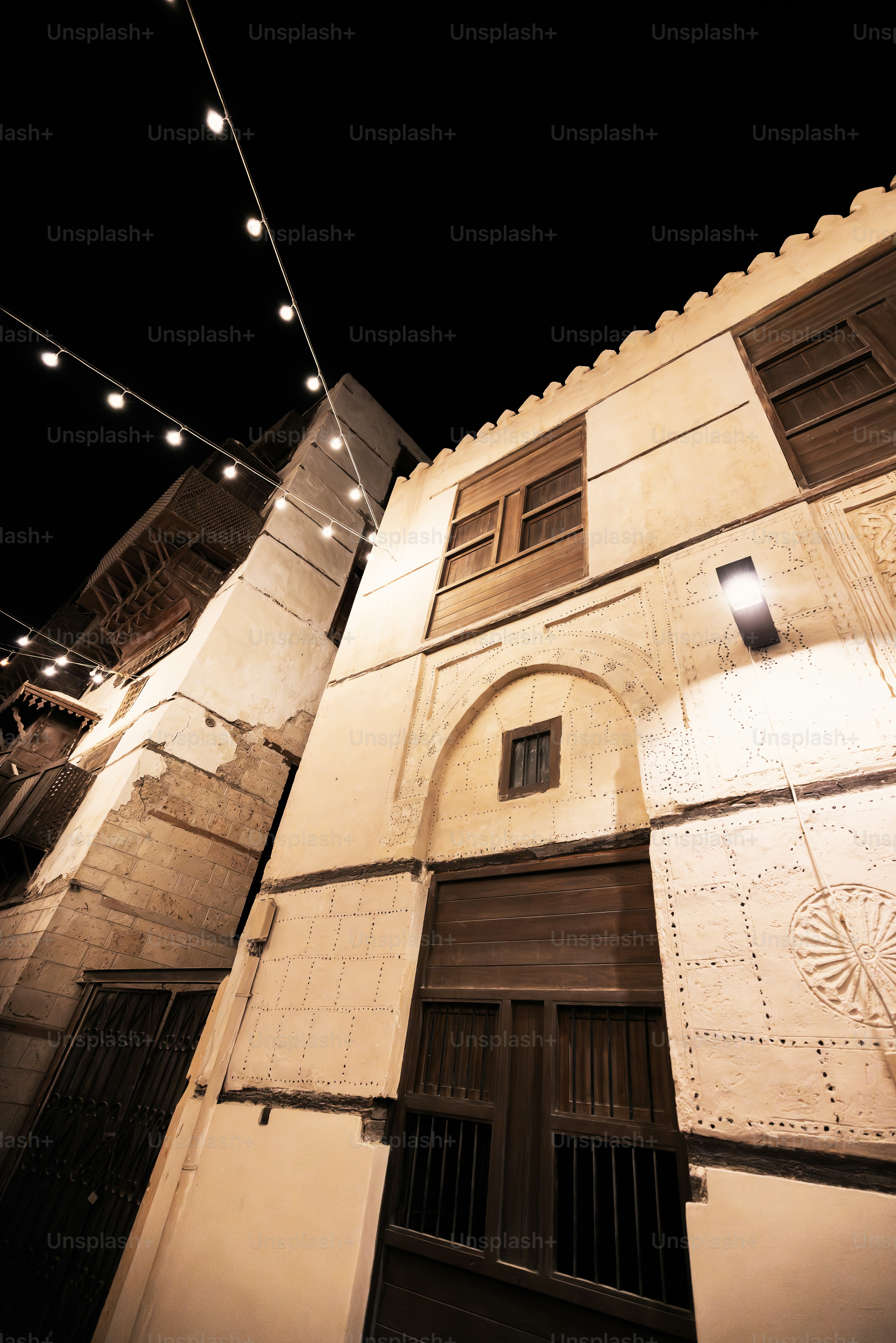 A building with a string of lights hanging from it's side