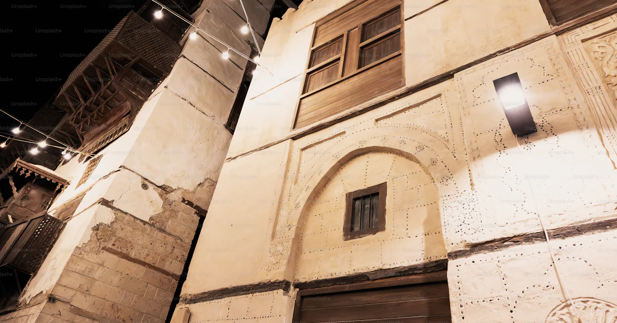 Building With String A building with a string of lights hanging from it's side photo – City ...
