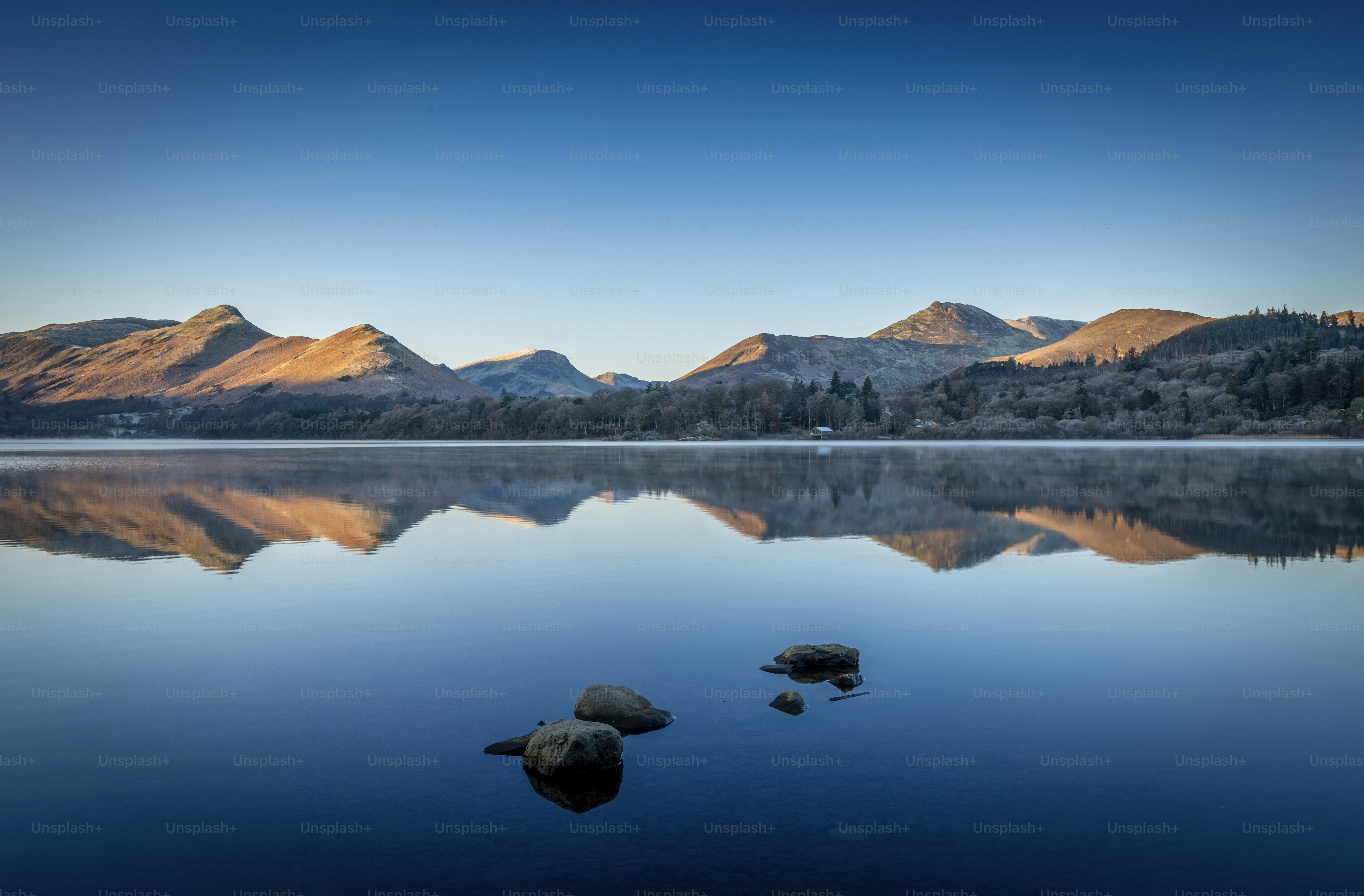 A large body of water surrounded by mountains