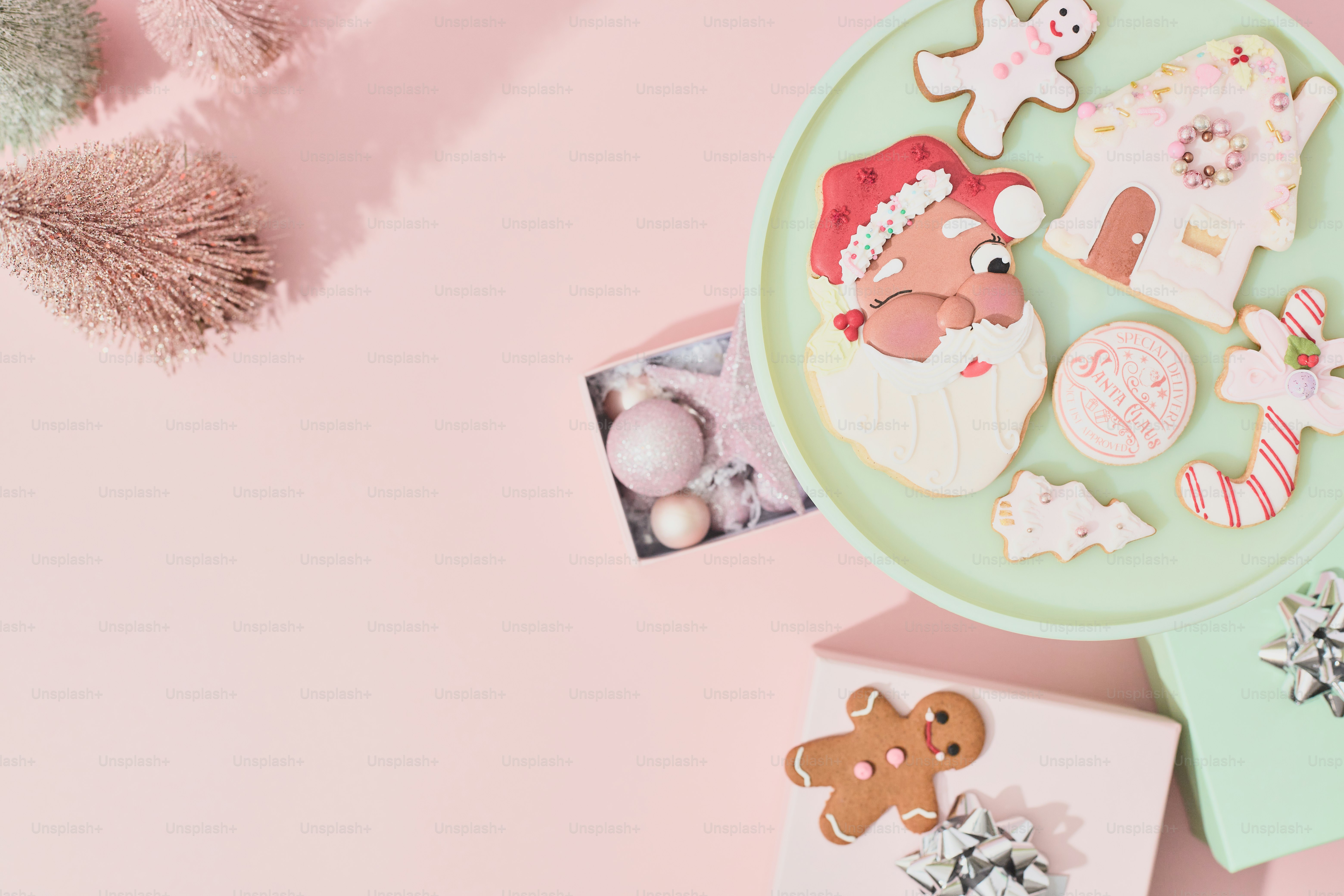 A plate of cookies on a pink background