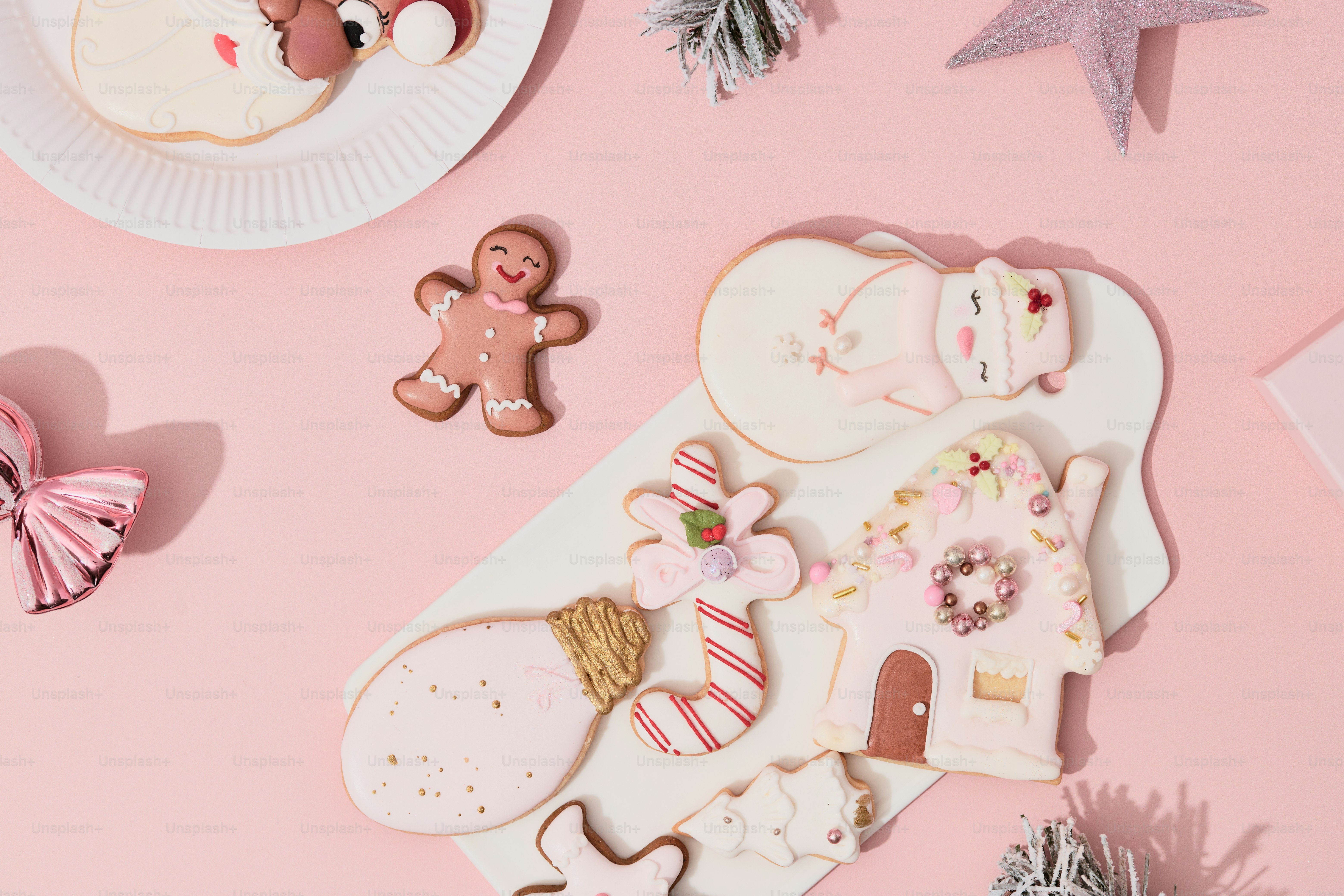A pink table topped with lots of cookies