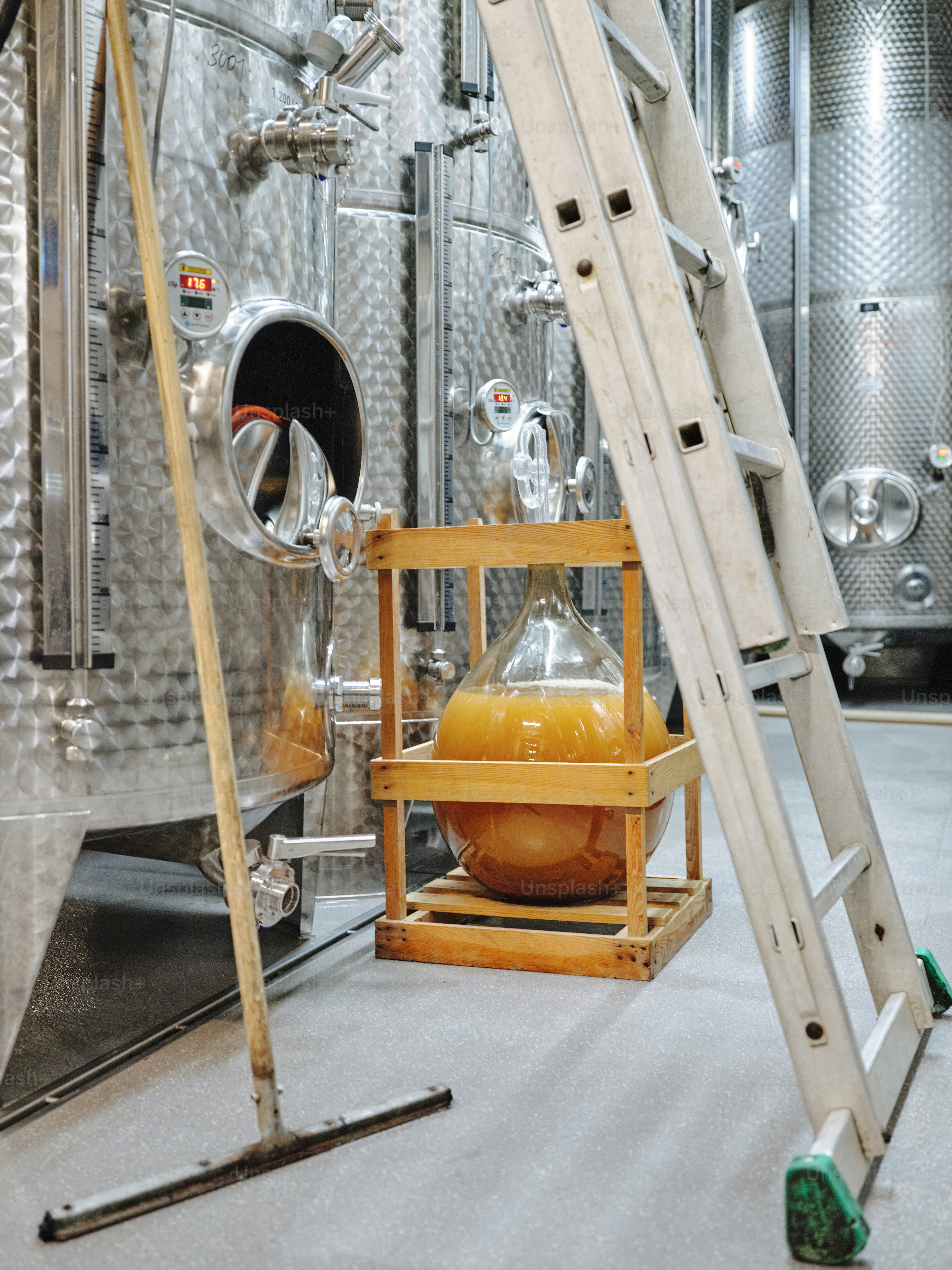 A large metal tank with a ladder next to it