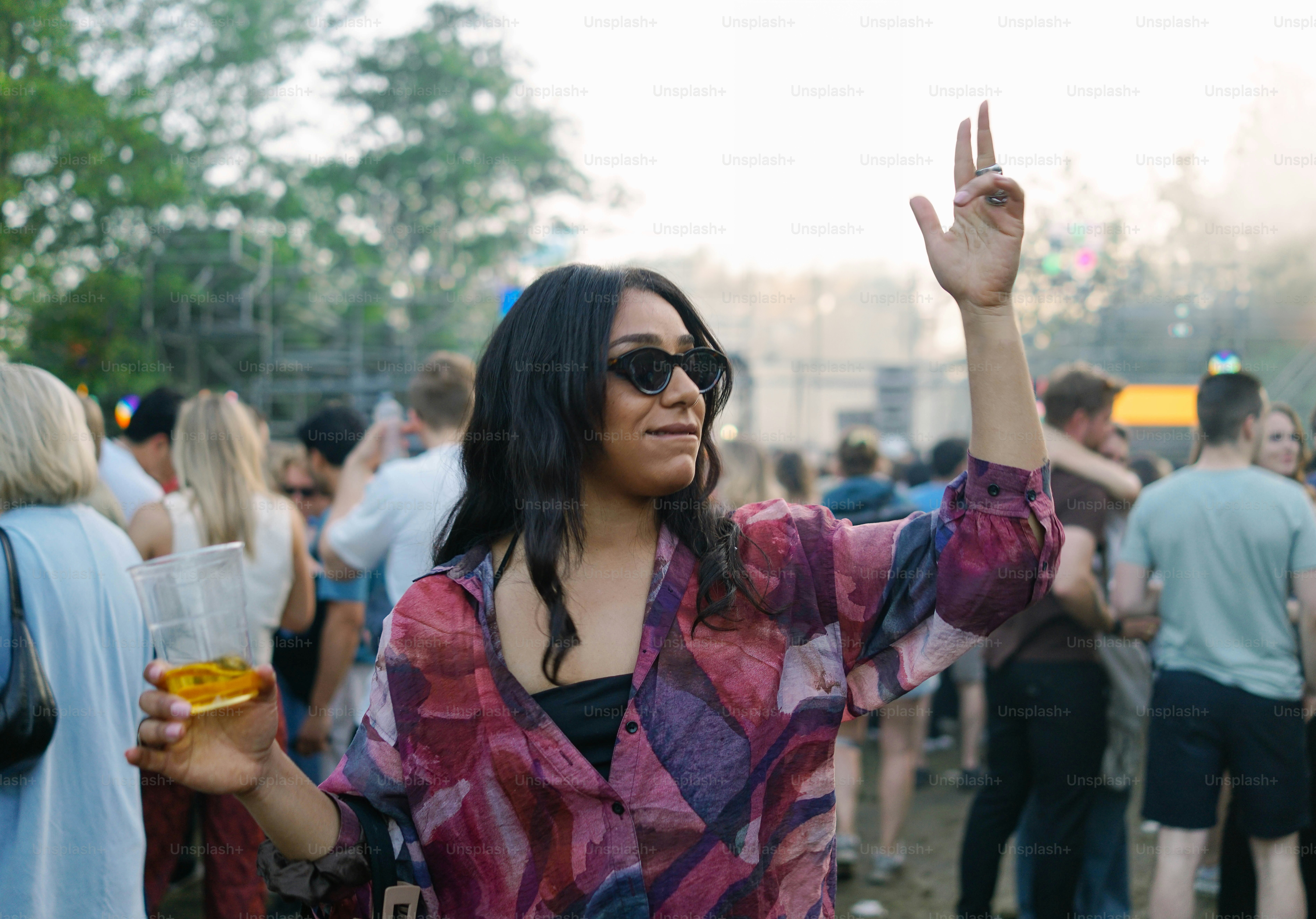 A woman standing in front of a crowd of people