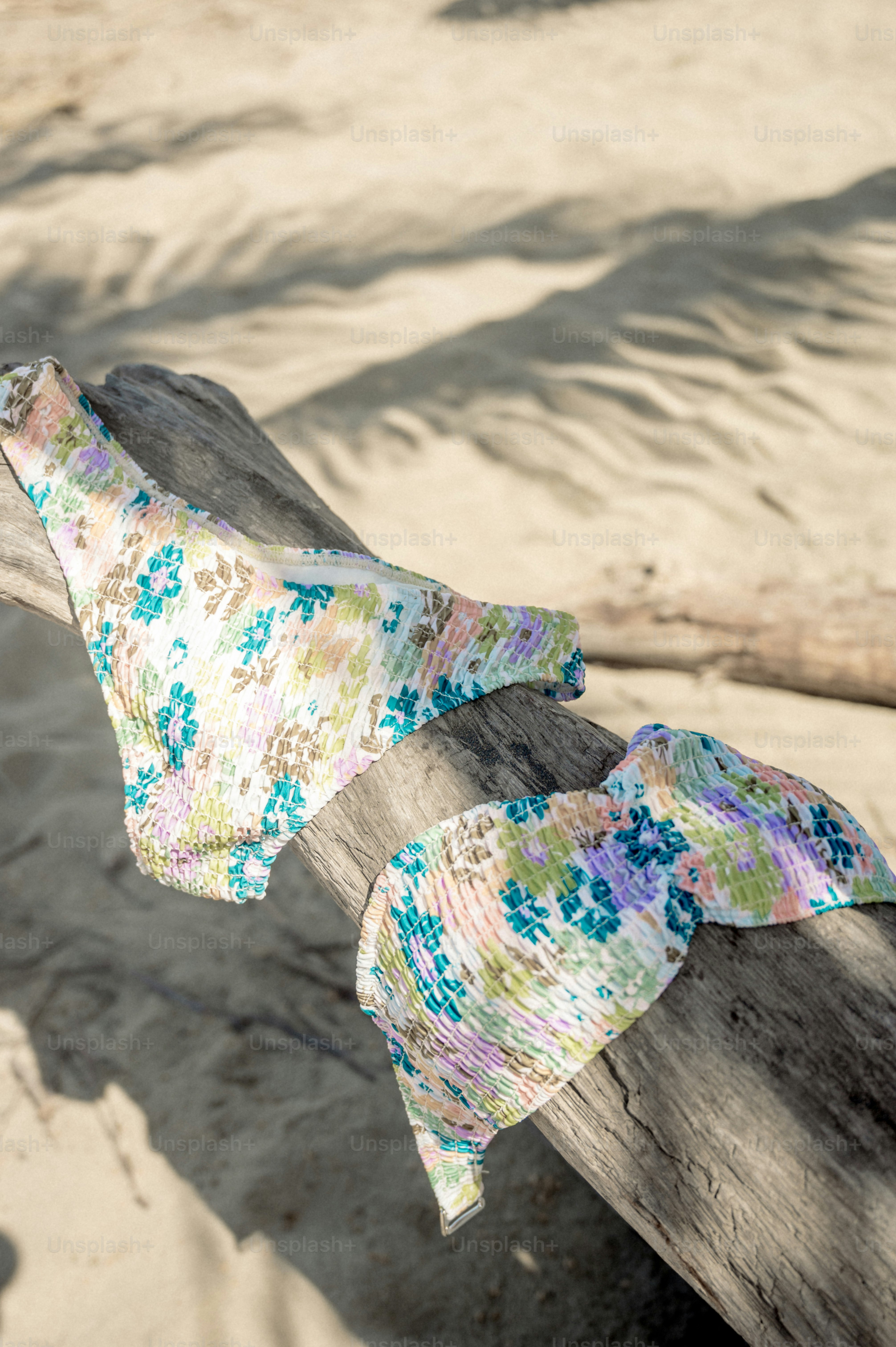 A piece of fabric sitting on top of a piece of wood